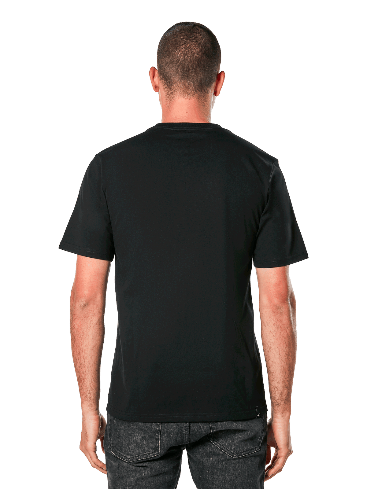 Alpinestars Ride 4.0 CSF Tee, set bagfra, sort kortærmet t-shirt, afslappet motorsport-inspireret sportstøj, bæres af mand med mørke jeans
