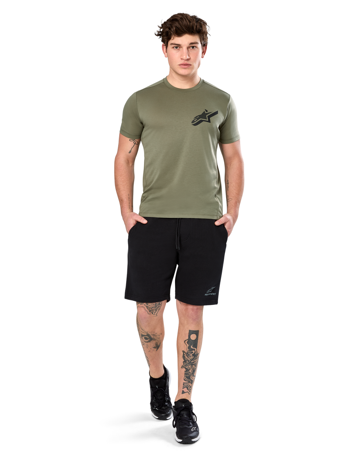 Alpinestars Attrition Performance Tee, Short Sleeve T-Shirt, Light Green, featuring a black Astars logo on the chest, worn with black athletic shorts and black sneakers, casual performance sportswear lifestyle shot