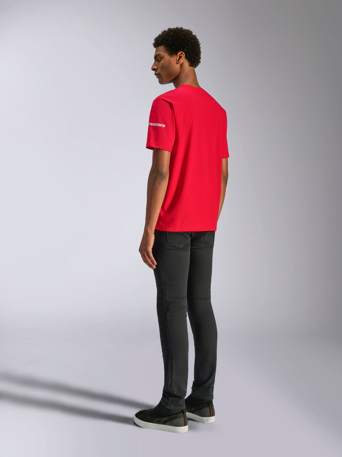 Alpinestars Frontal CSF Tee, Short Sleeve T-Shirt, Red, back view on model, featuring white logo on the sleeve, paired with black pants, performance casual streetwear
