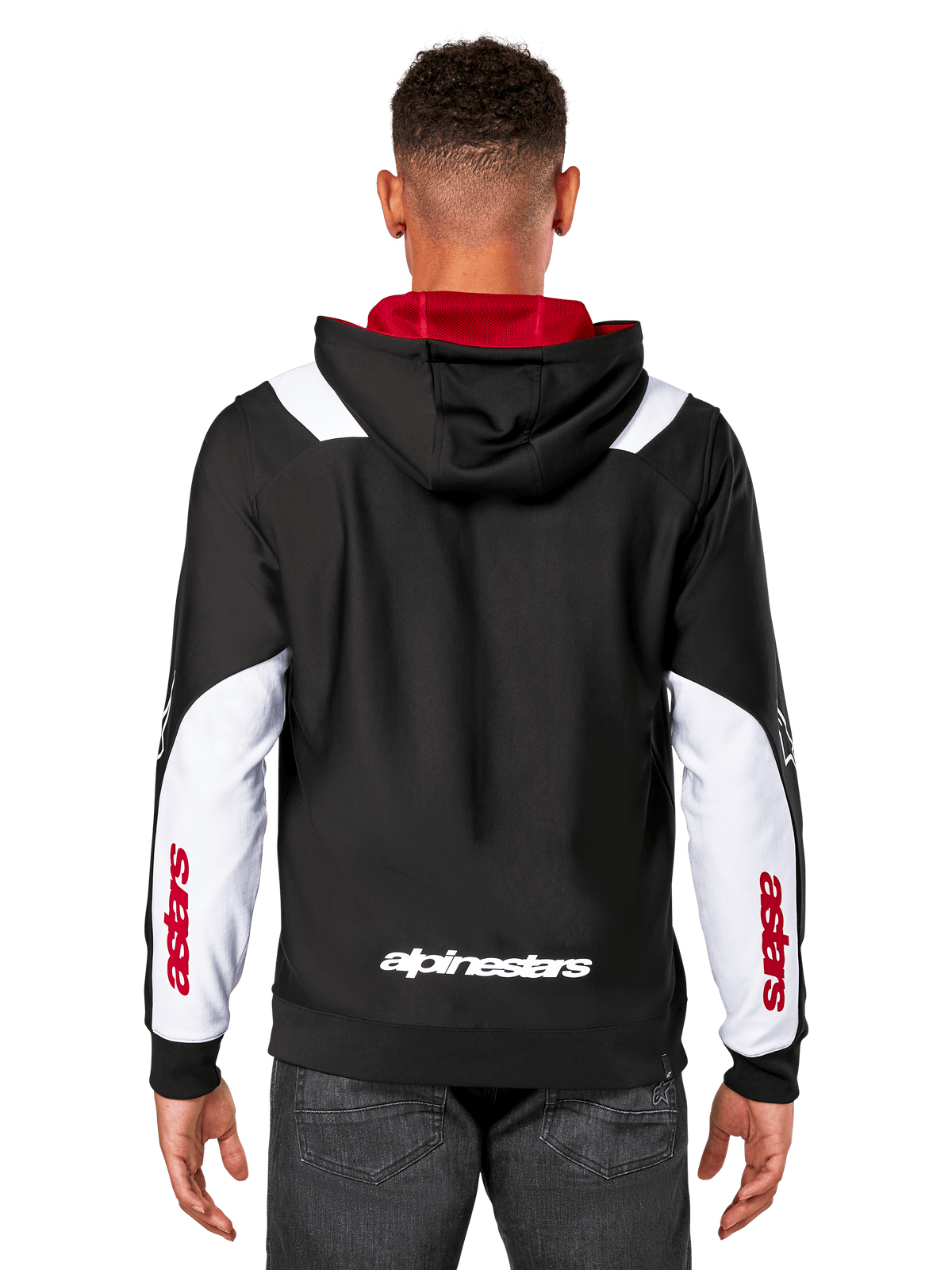 Alpinestars Sessions V3 hættetrøje, set bagfra, sort med hvide ærmepaneler og rødt hættefor, med hvidt tekstlogo bagpå og rød branding på ærmerne, afslappet motorsport-inspireret streetwear