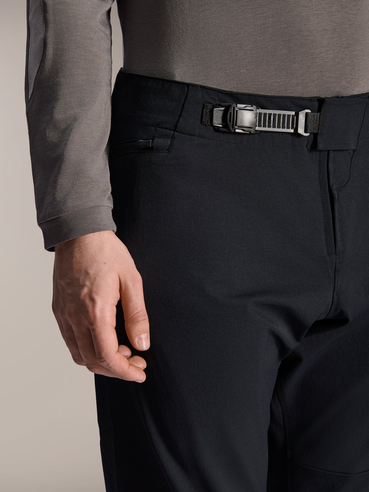 Alpinestars A-Dura Elite Pants, Black, close-up of the front ratchet closure system and zipper fly, zippered side pocket, technical mountain bike pants made with durable Cordura fabric