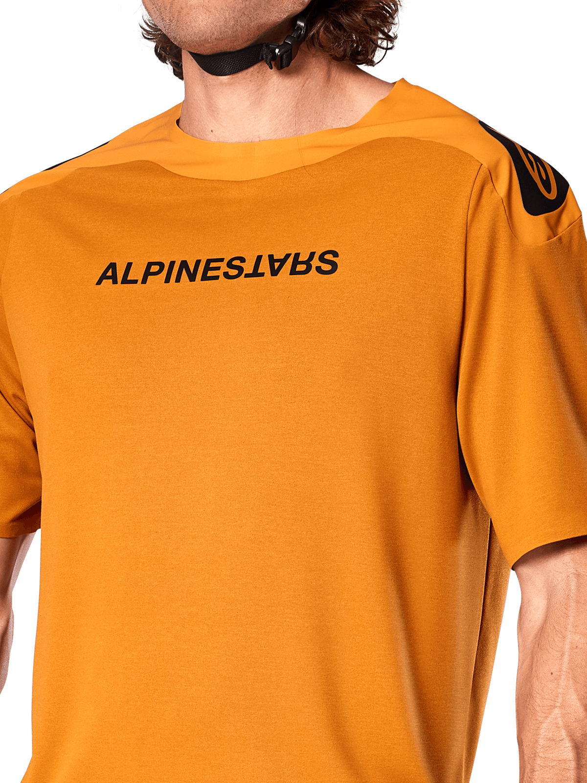 Alpinestars A-Aria Polartec Switch Jersey, Short Sleeve MTB Jersey, Dark Gold, featuring mirrored black Alpinestars logo on the chest, technical performance fabric for mountain bike trail riding