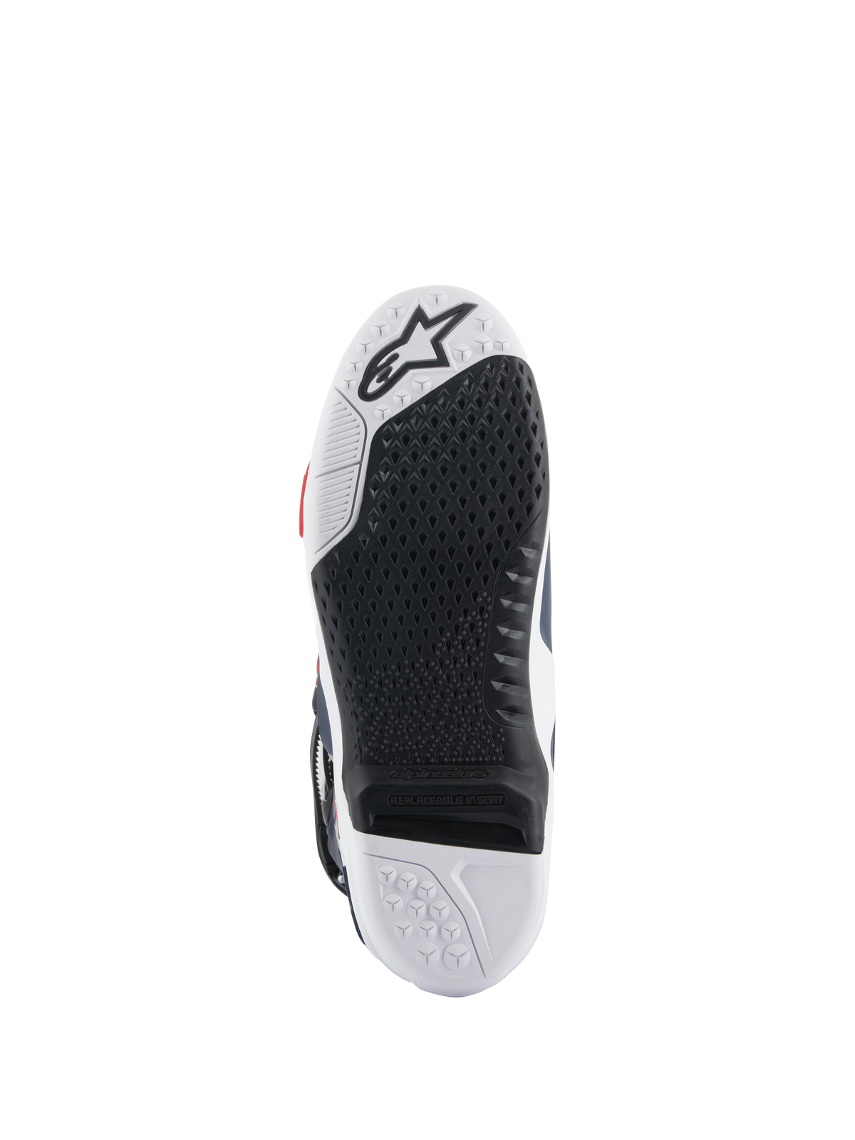 Alpinestars Tech 10 Supervented-støvlesål, set fra bunden, sort og hvidt dobbeltforbindelses-design, bikage-grebstekstur, udskiftelig central indsats, præget Alpinestars-logo, optimeret til ydeevne på motocross-fodhvilere.