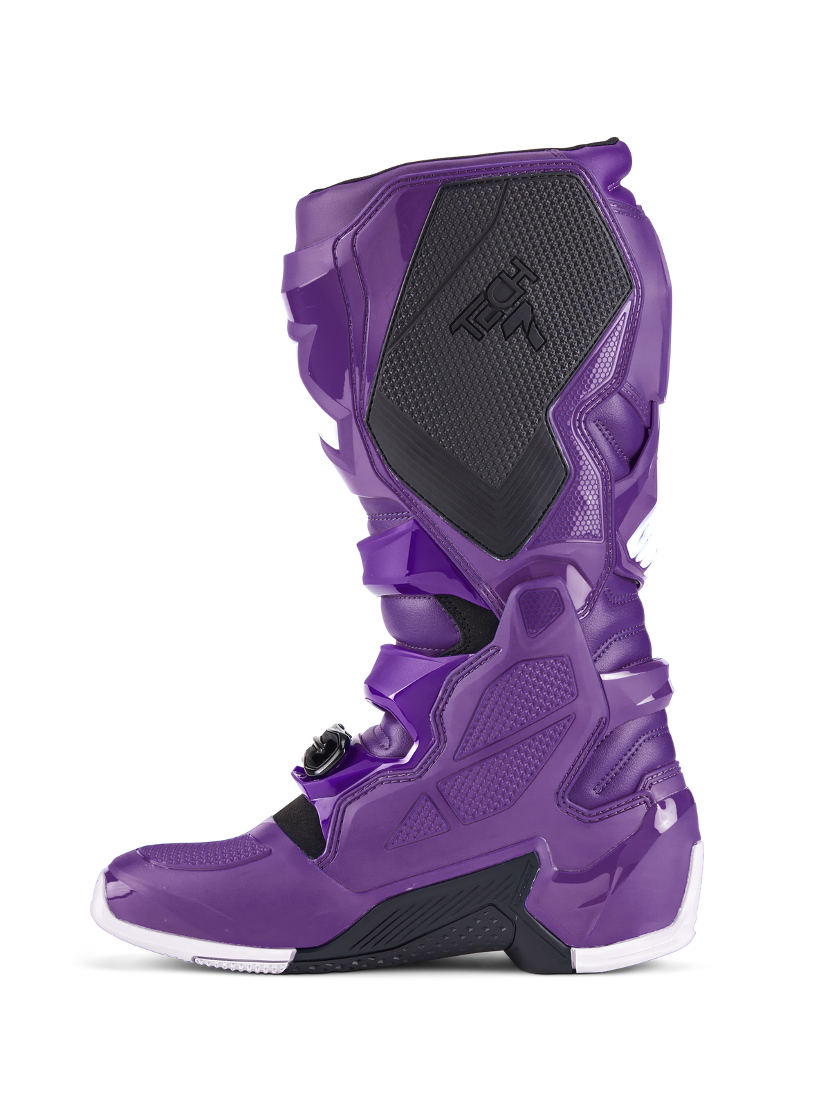 Alpinestars Tech 7 støvler, lilla motocross-støvler, sideprofil der viser sort tekstureret lægbeskyttelse med TECH 7-branding, lilla TPU-skal, sikkert spændesystem og hvide detaljer på sålen, specialiseret fodtøj til off-road racing