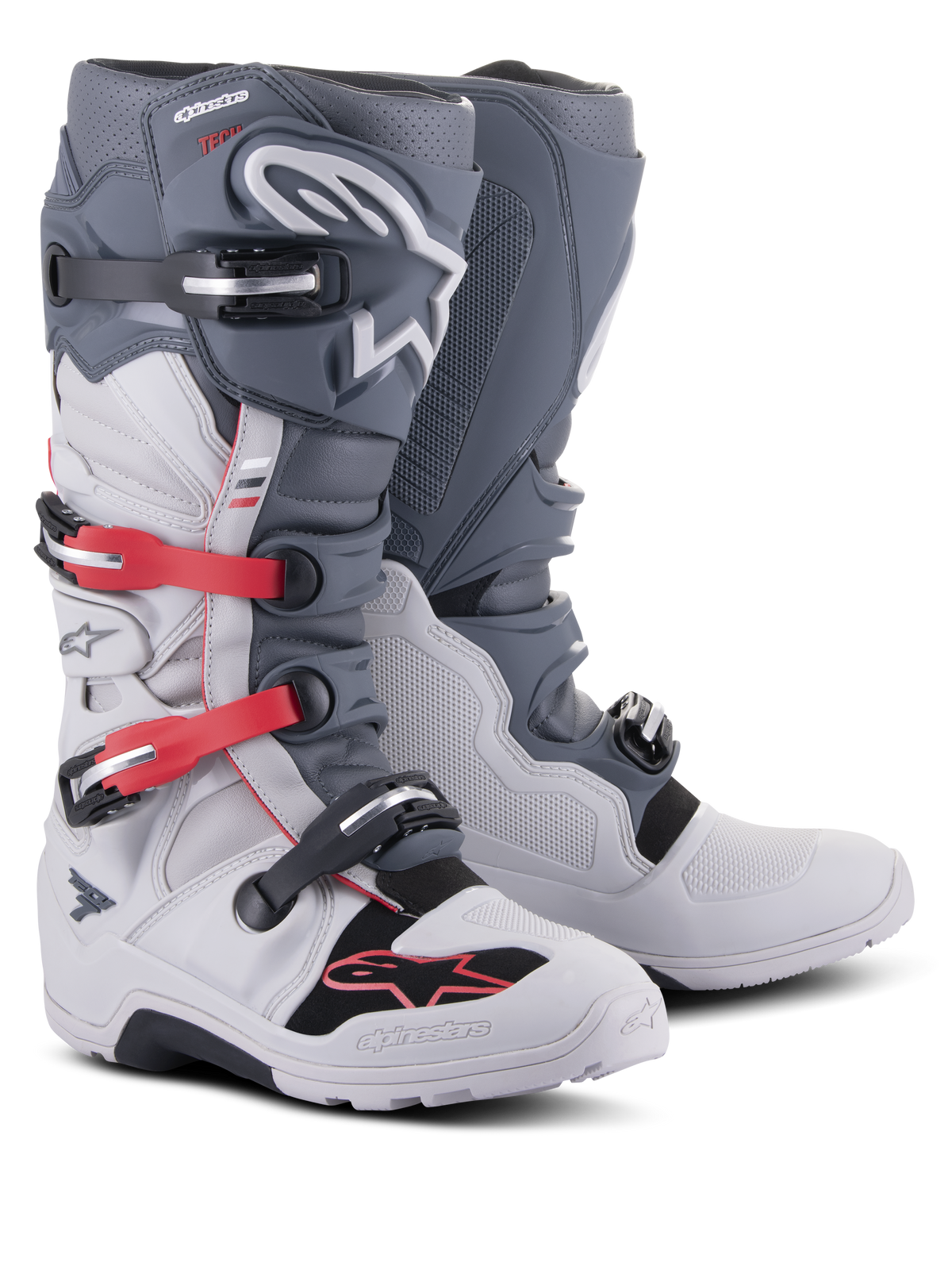 Alpinestars Tech 7 Enduro Boots, off-road motorcycle footwear, Light Gray and Dark Gray with Bright Red accents, featuring a multi-buckle closure system and a rugged compound sole designed for enduro and trail riding.