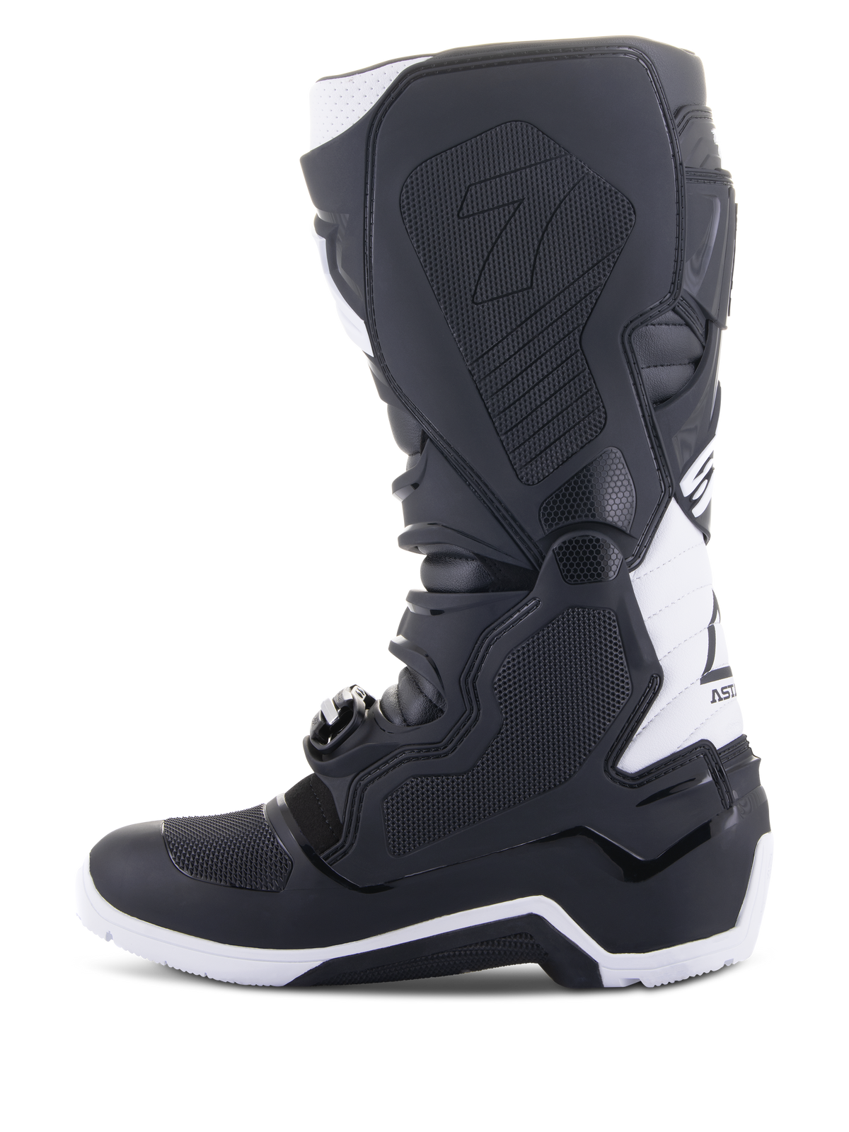 Alpinestars Tech 7 Enduro Drystar® støvler, enduro-motorcykelstøvler, sort og hvid, set fra den indvendige side med gribepaneler i bikagestruktur, TPU-konstruktion og hvide detaljer på hælen og øverst på læggen, professionelt off-road fodtøj