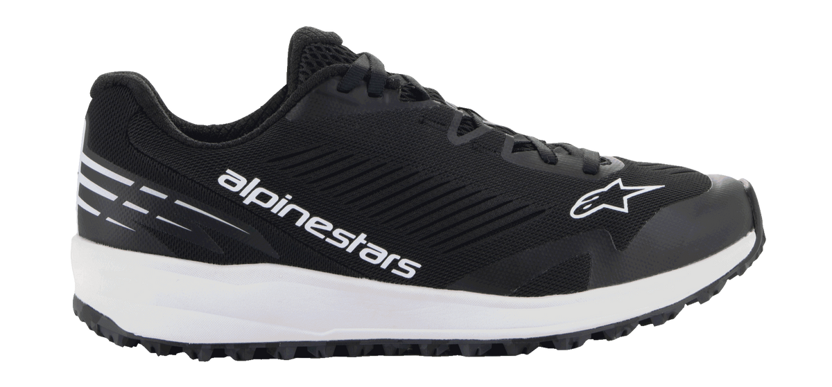 Alpinestars Meta Road V2 Shoes, black athletic footwear with a thick white sole, featuring white Alpinestars branding and star logo, textured mesh upper, black laces, and rugged grip outsole, lightweight sporty design for race-team workwear and casual use