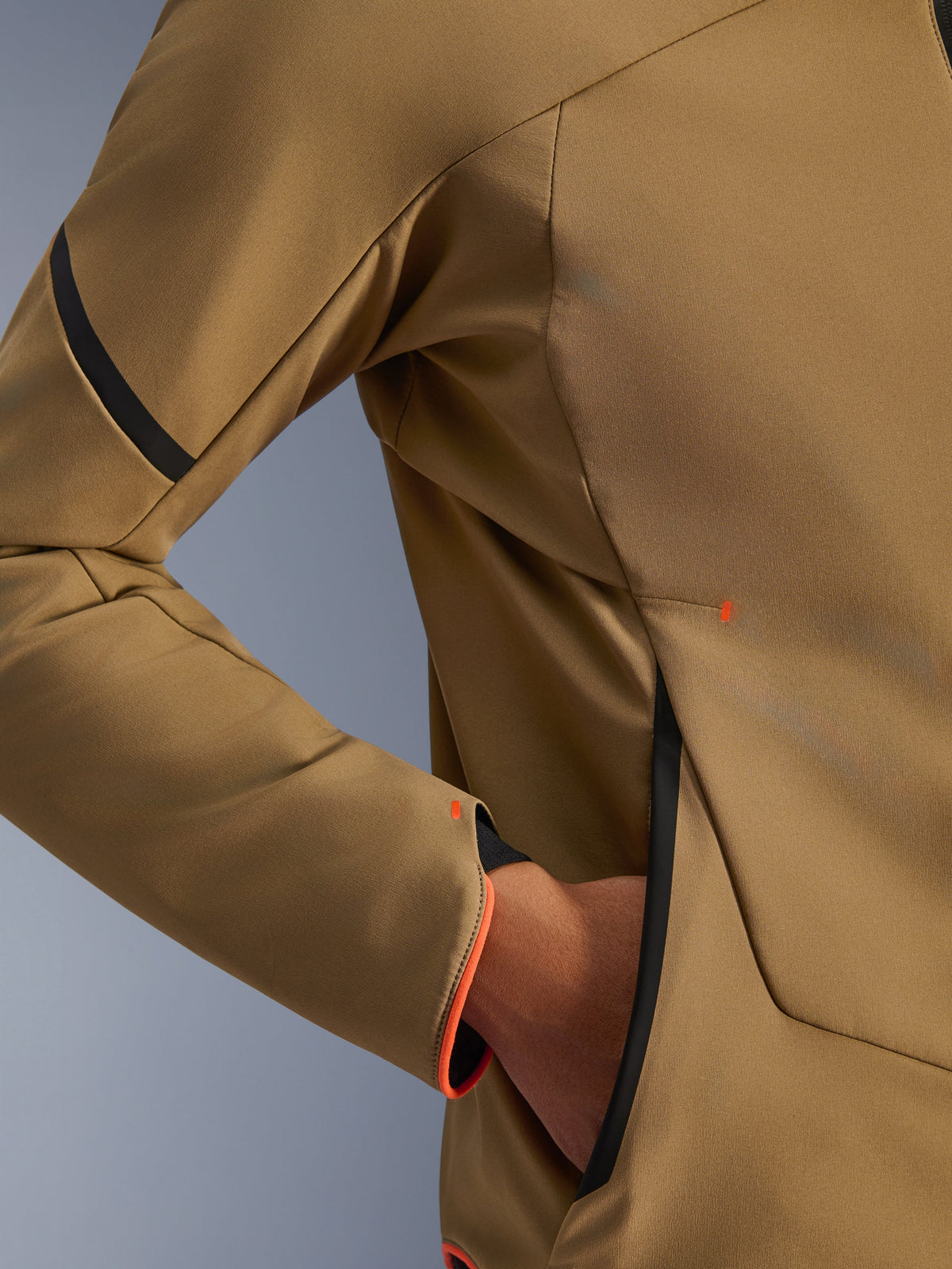 Close-up of Alpinestars Aeroshell Waterproof Jacket, Dark Khaki with black and orange fluo accents, detail of the hidden zipped hand pocket and sleeve cuff, stretch softshell textile for motorcycle riding