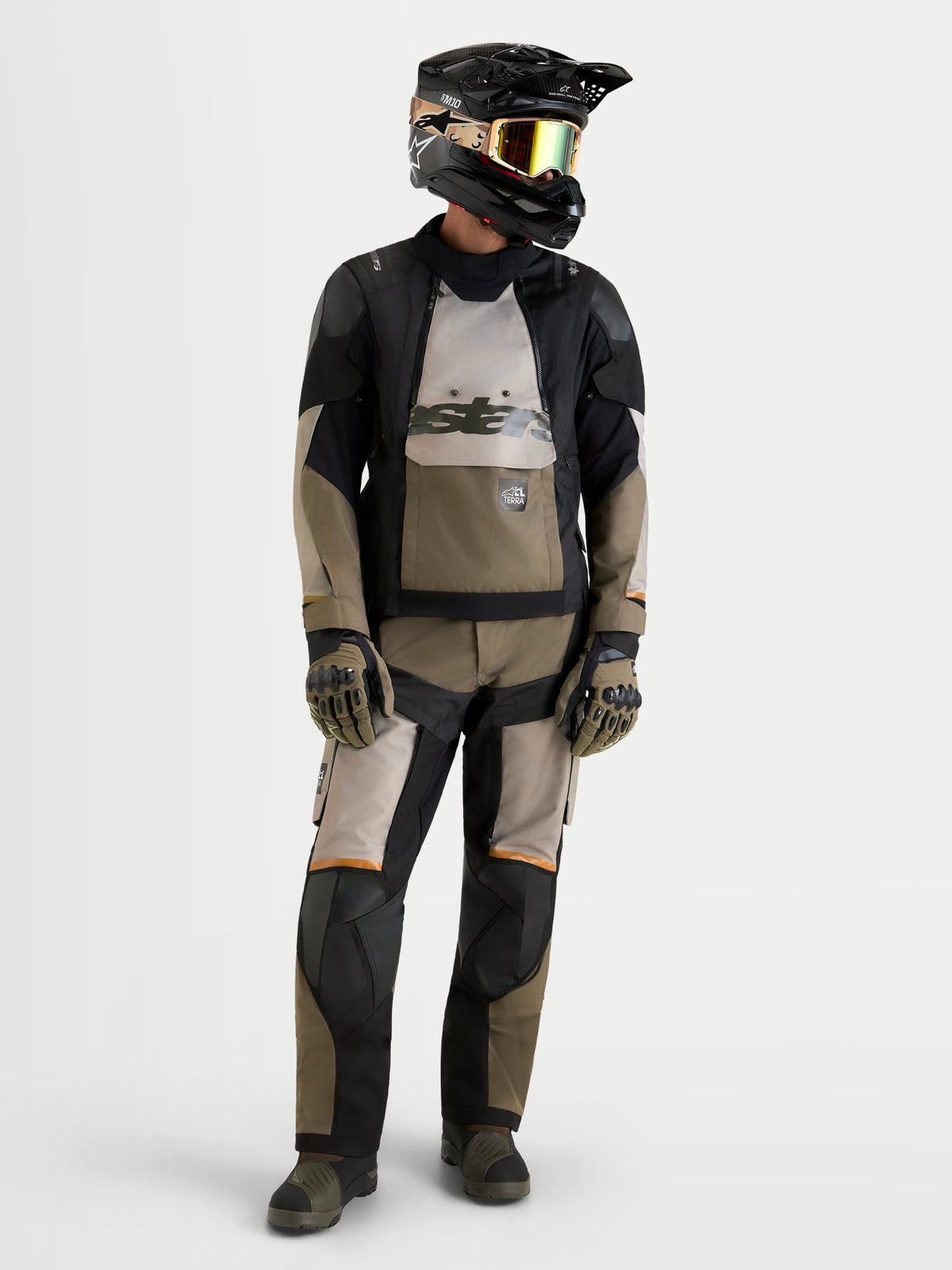 Alpinestars Harok V2 Drystar Gear Set, motorcycle adventure touring gear set, worn by a model wearing a helmet and gloves, black and khaki, waterproof textile construction