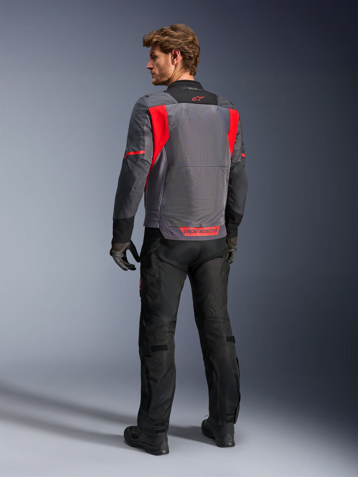 Alpinestars ST-2 Air Jakke til herrer i grå og rød med mesh-rygpanel til ventileret adventure touring.
