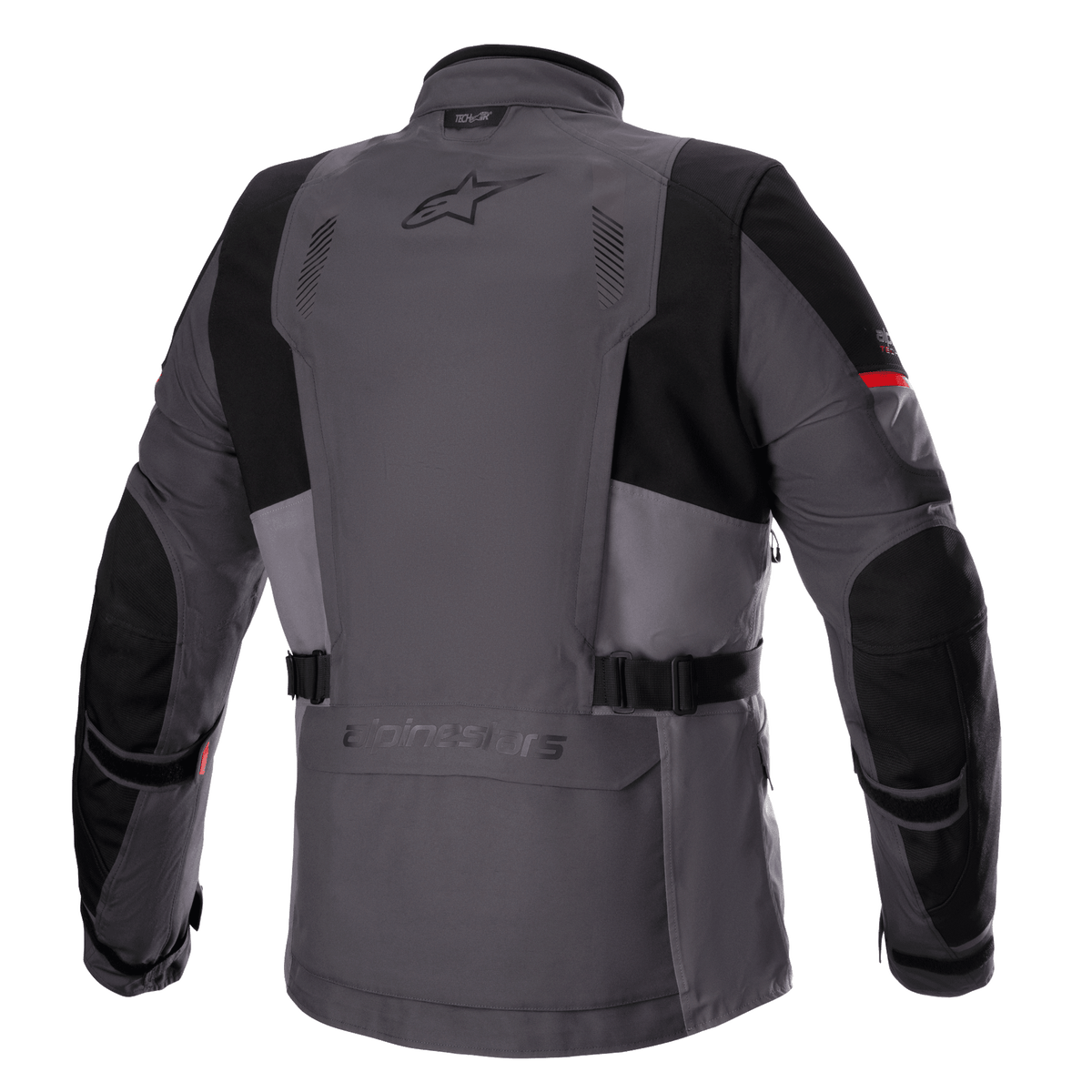 Alpinestars Monteira Drystar® XF jakke, adventure touring motorcykeljakke, mørkegrå og tar-grå med klare røde detaljer, set bagfra med praktisk baglomme, taljeremme og forstærkede sorte paneler på skuldre og albuer, med Astars-logo på den øverste del af ryggen.