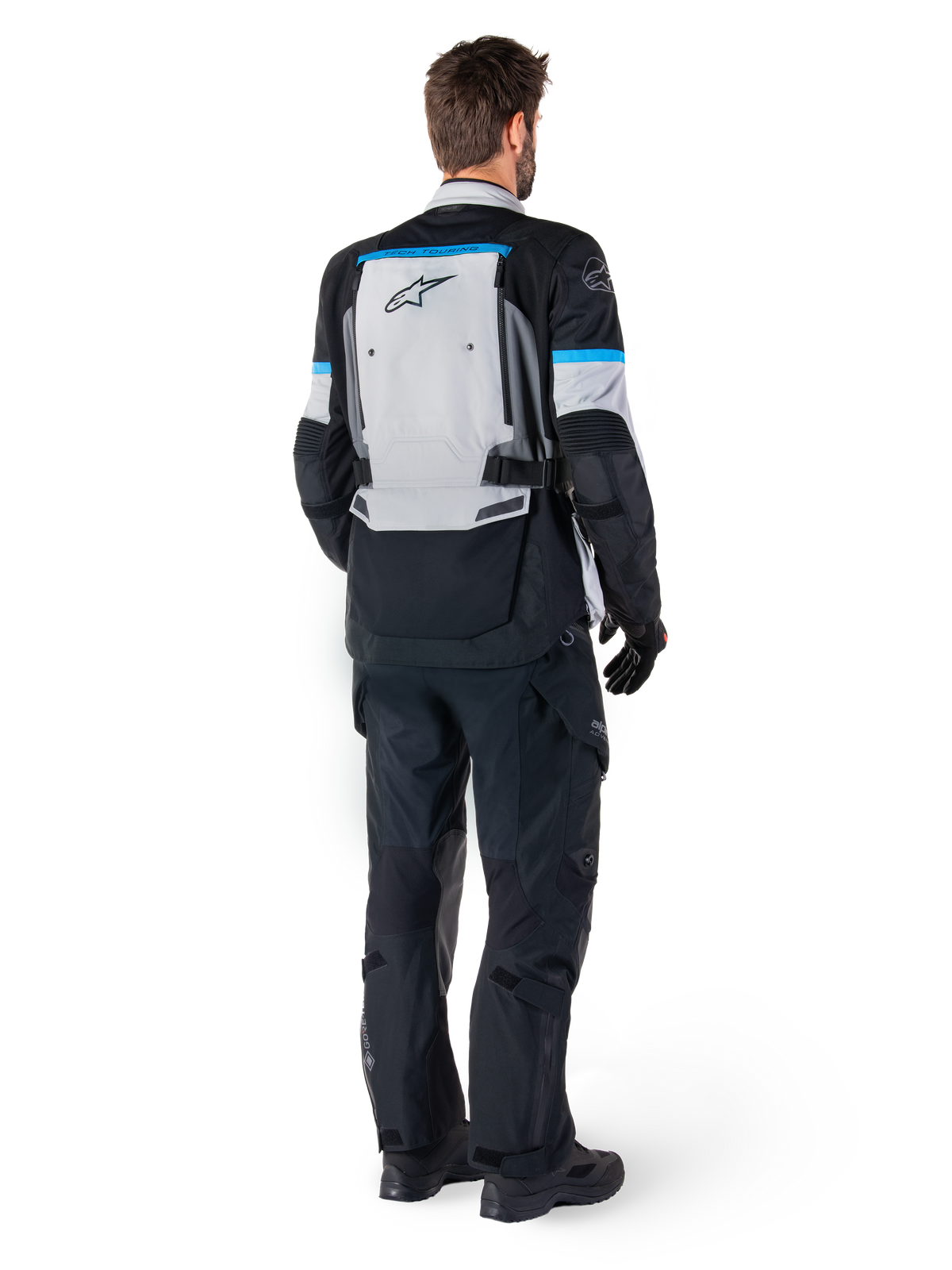 Alpinestars Bogota' Pro Drystar® herrejakke, adventure-motorcykeljakke, isgrå, sort og cyan, set bagfra.