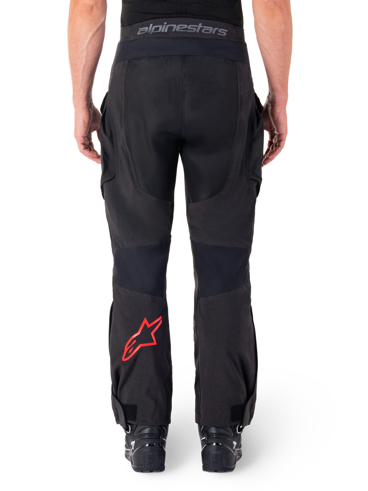 Alpinestars Hyde XT Drystar® Pants, Adventure Motorcycle Pants, Black with red star logo on the lower leg, back view, over-the-boot enduro design with durable textile panels and branded waistband.