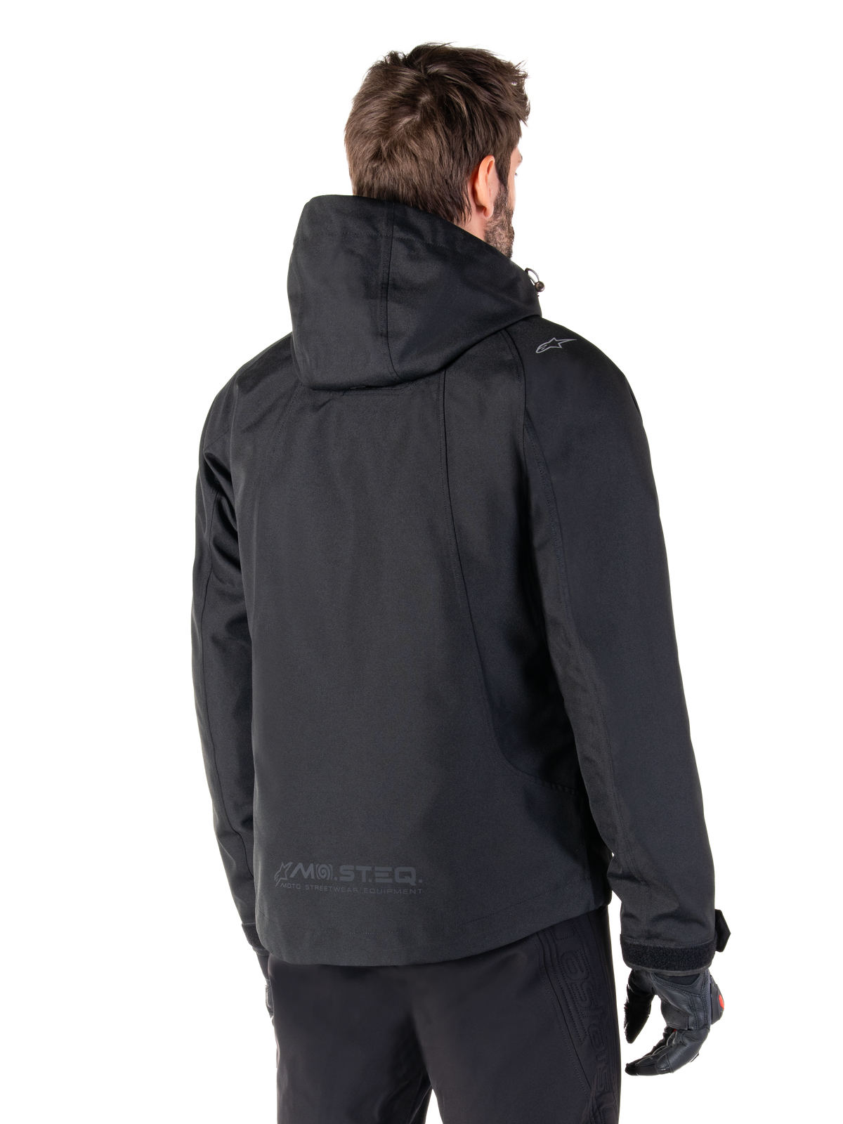 Alpinestars Morush vandtæt parka, urban herre-motorcykeljakke, sort, set bagfra med hætte og MO.ST.EQ.-branding.