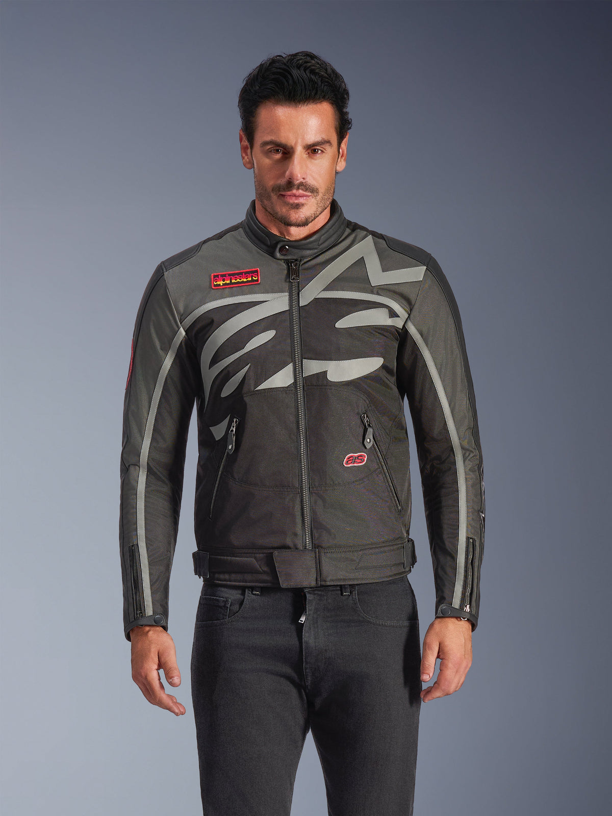 Alpinestars Axton Jacket, Men's Urban Motorcycle Jacket, Black and Anthracite with red accents, featuring a large wrap-around light gray graphic, red logo patches on the chest and pocket, front zipper and zippered cuffs, vintage-inspired racing design for street riding