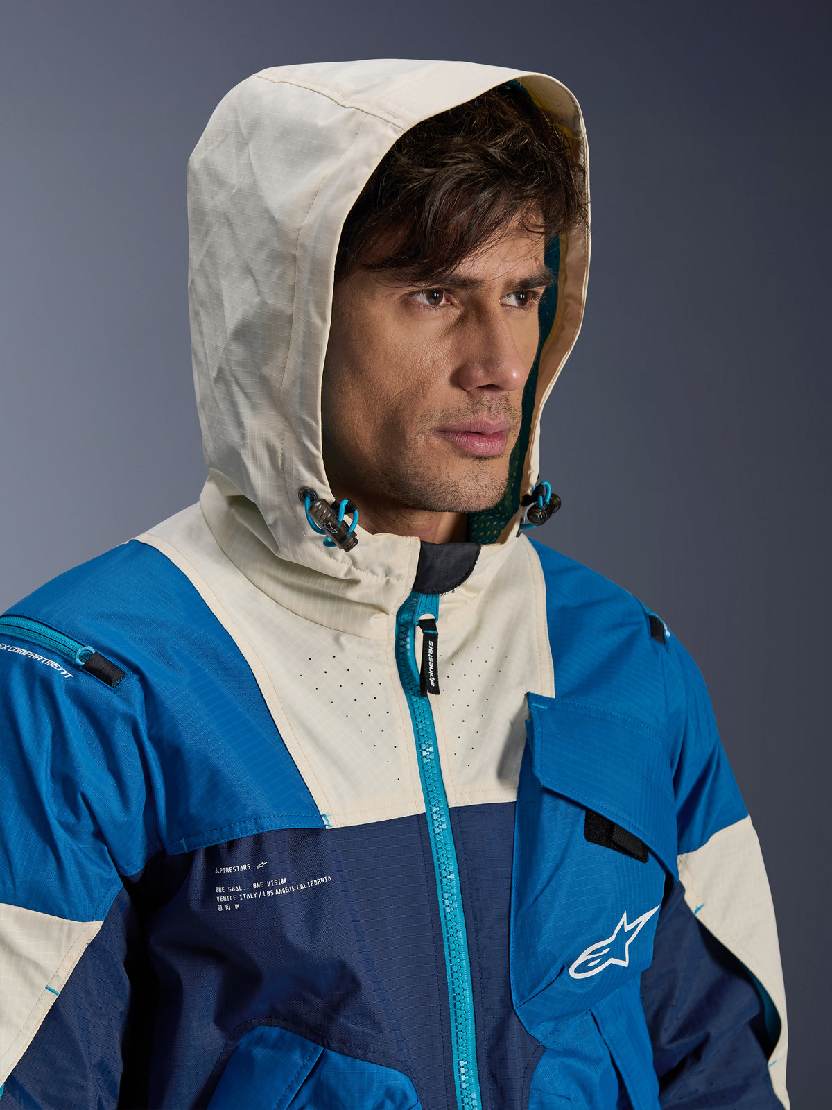 Alpinestars Mogress Air herre-motorcykeljakke, blå og creme, urban stil i ventileret tekstil med hætte.