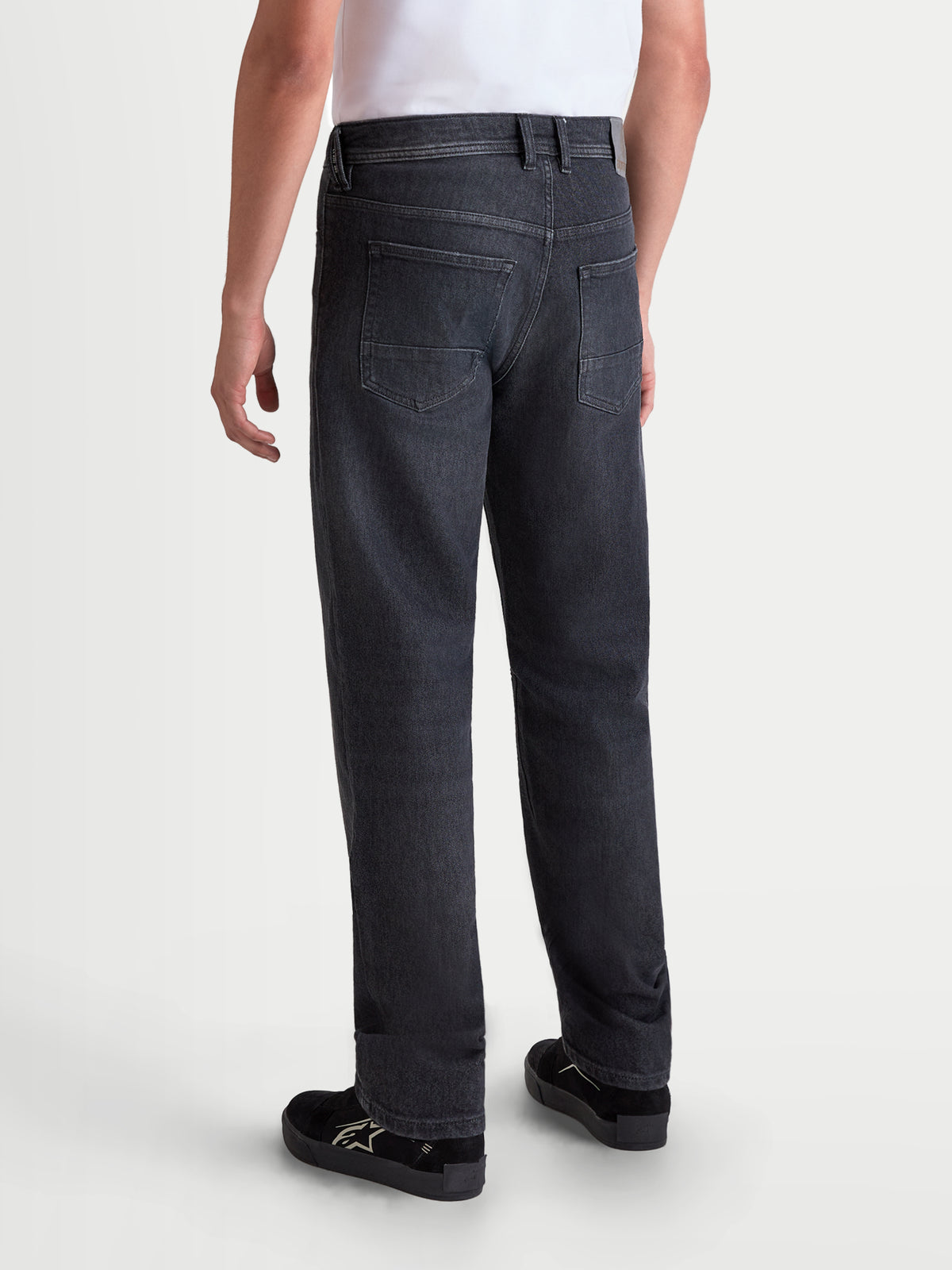 Alpinestars Flex-AST 8 Denim Pants, men's urban motorcycle riding jeans in Used Black, rear view showing single-layer technical denim construction, back pockets, and regular straight fit worn by a model