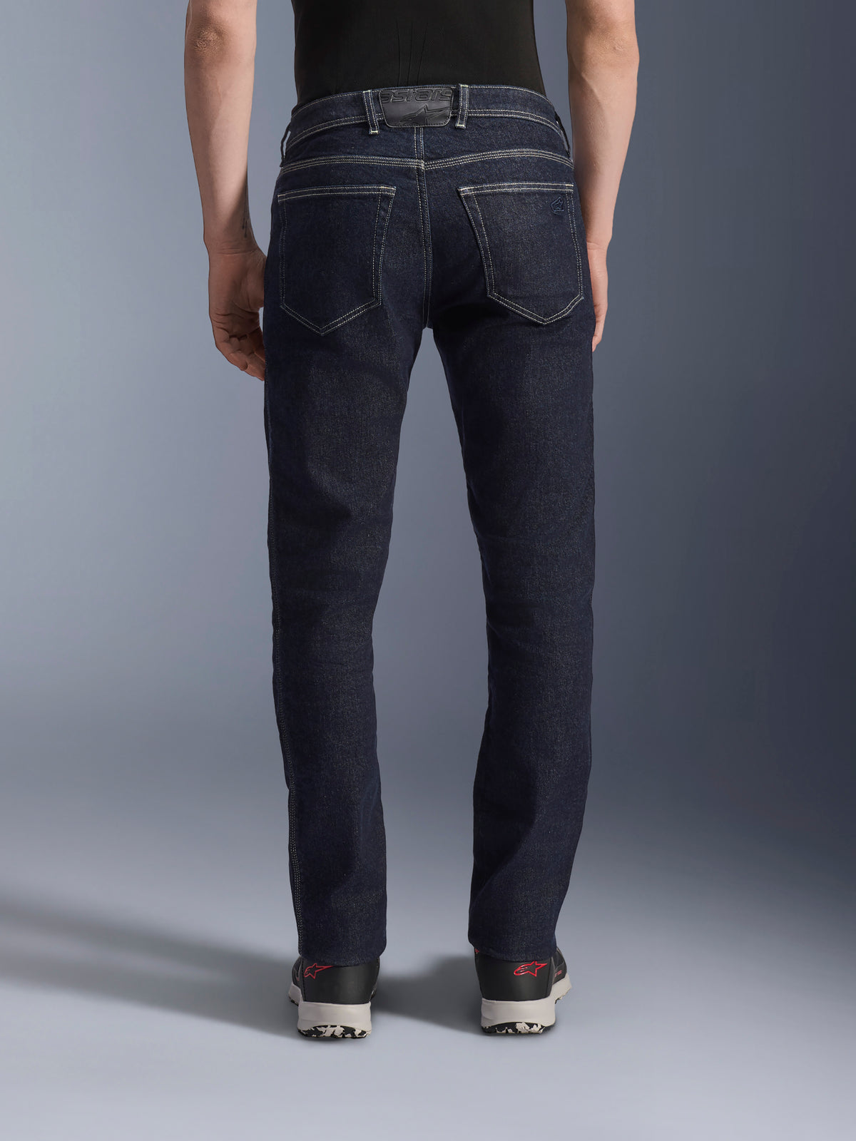 Alpinestars Copper V3 Denim Pants, Men's Urban Motorcycle Riding Jeans in Rinse Blue, back view on model showing regular straight-leg fit, rear pockets, and contrast stitching.