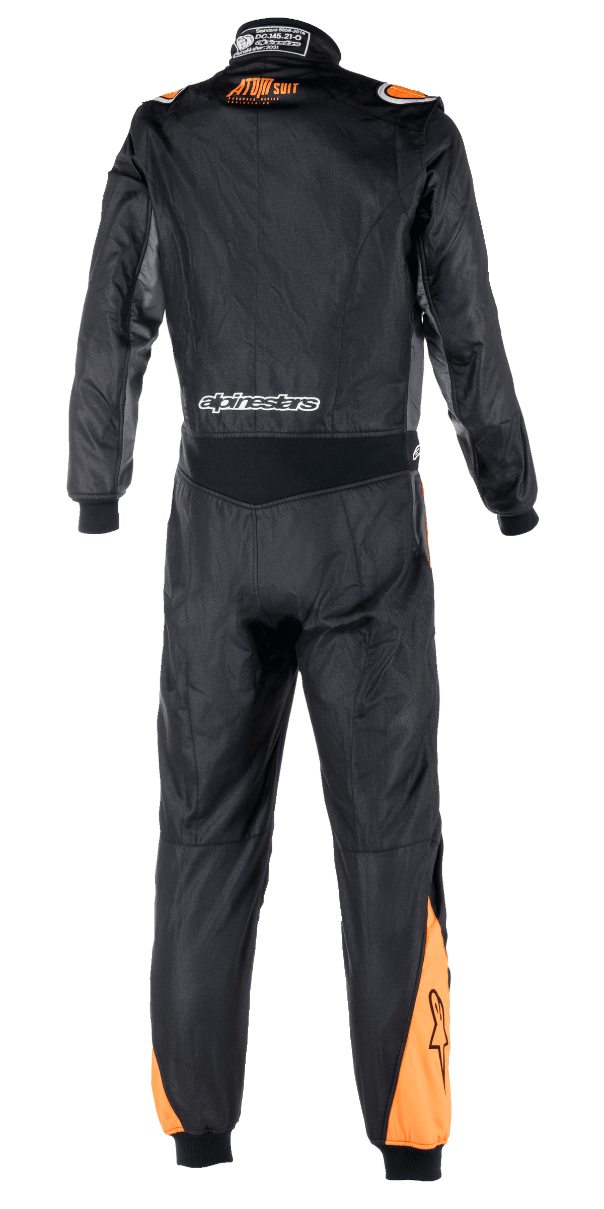 Alpinestars Atom FIA Graphic Suit, back view of a one-piece auto racing suit, Black and Anthracite with Orange Fluo accents on shoulders and calves, featuring FIA certification details on the collar and Alpinestars branding across the lower back.