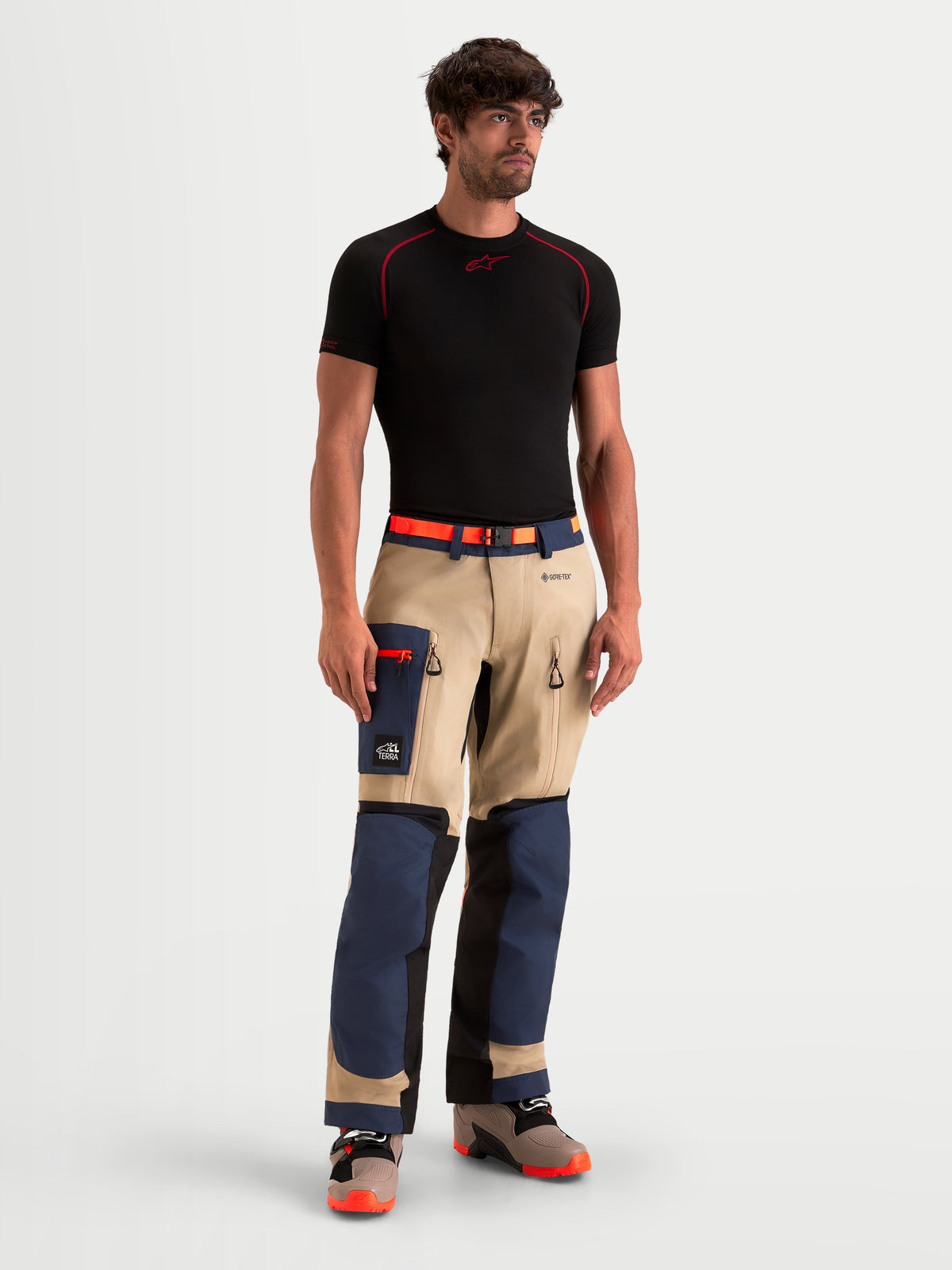 Alpinestars Arenis Gore-Tex Pants, men's adventure touring motorcycle pants in night navy and aluminum, front view worn by a model showcasing waterproof textile construction and cargo pockets
