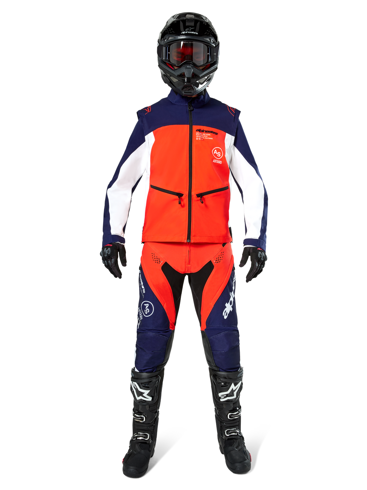 Motocross rider wearing complete off-road gear, Lite-Dura Softshell Jacket in Navy Hot Orange and White, matching navy and orange pants, black helmet with goggles, black and white boots, black gloves, coordinated outfit for enduro racing