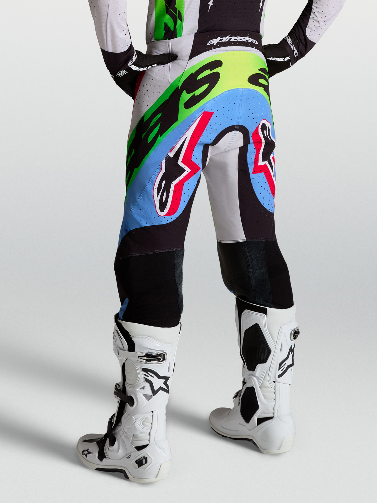 Alpinestars Supertech Dyna Pants, Motocross Racing Pants for Men, Light Lilac, Green, and Black with perforations and goat leather knees.