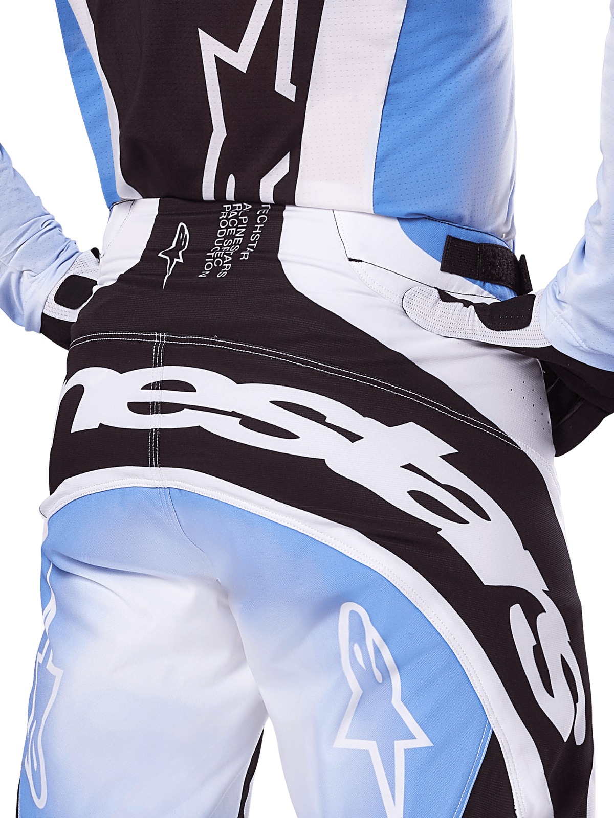Alpinestars 2025 Techstar Melt bukser, motocross-bukser, sort, hvid og blå, nærbillede bagfra med markant hvid branding på sædet, koordineret med matchende Techstar Melt jersey og handsker, professionelt racerudstyr til motocross