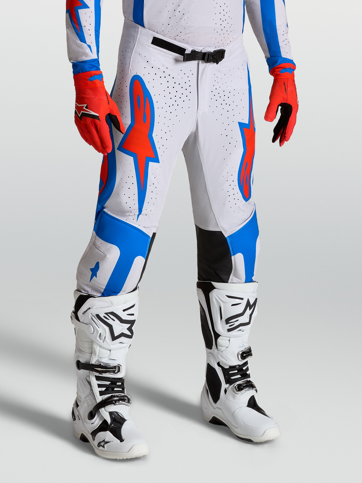 Alpinestars 2027 Supertech Vesta Pants, pro-level motocross gear for racing, Cardinal Red and White with blue accents, stretch rip-stop fabric construction.