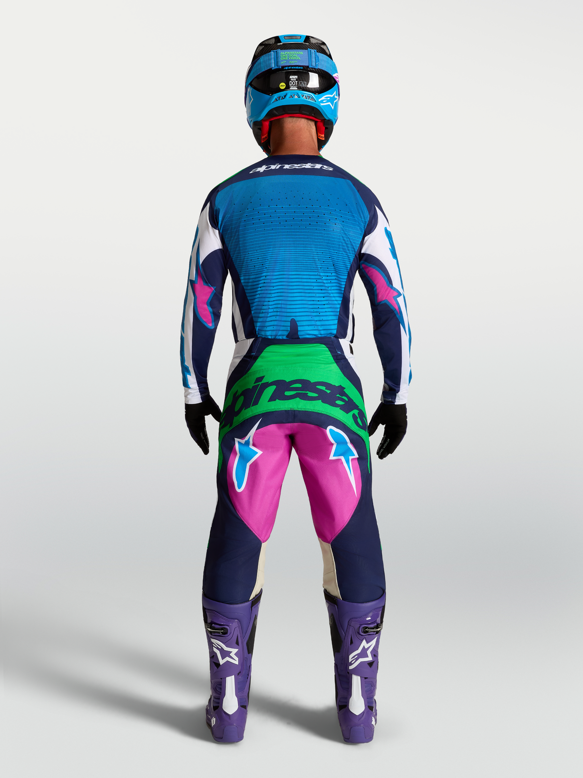 Alpinestars Techstar Maven gearsæt og bukser, motocrossudstyr til herrer, blå og pink, set bagfra på model.
