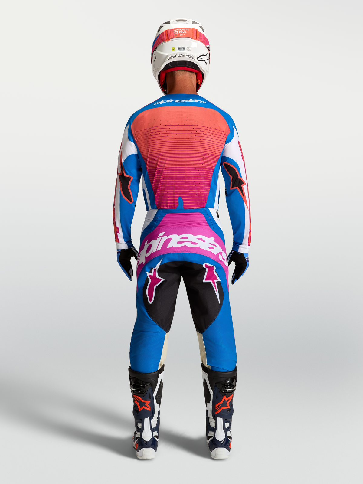 Alpinestars Techstar Maven Pants, Men's Motocross Racing, Blue and Hot Coral, athletic fit rear view in full racing gear.