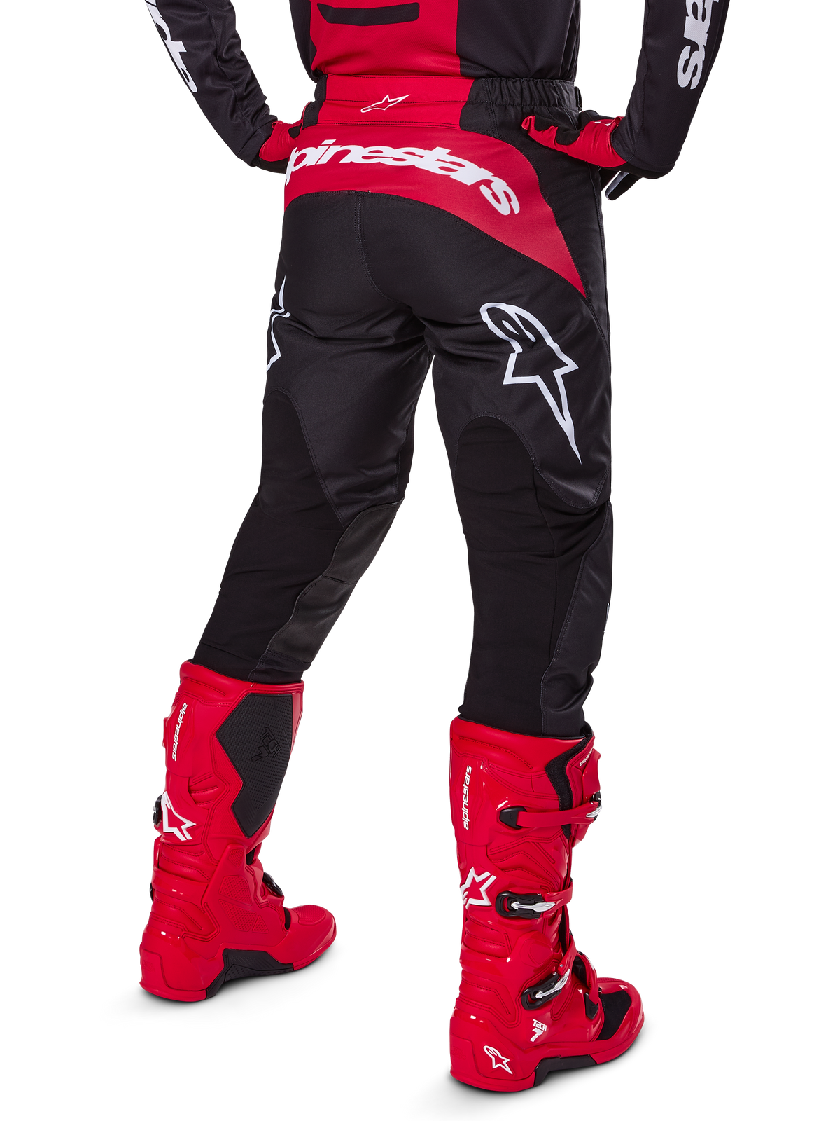 Alpinestars 2025 Fluid Haul Gear Set, Rear View, Black and Red motocross pants with large white logos, matching jersey, and vibrant red Tech 7 boots, coordinated off-road racing kit