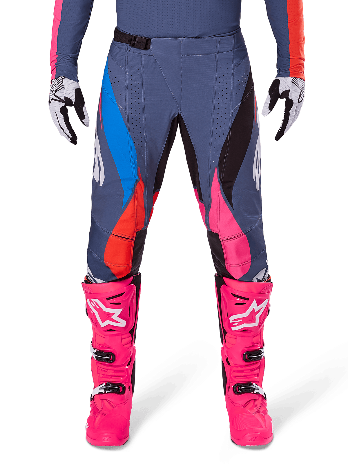 Alpinestars 2025 Techstar Dreem Pants, Motocross Pants, Gray Multicolor with blue, pink, and orange accents, worn with bright pink boots and white and black gloves, featuring laser-cut perforations on the thighs and a magnetic waist buckle, athletic race-fit gear for off-road competition