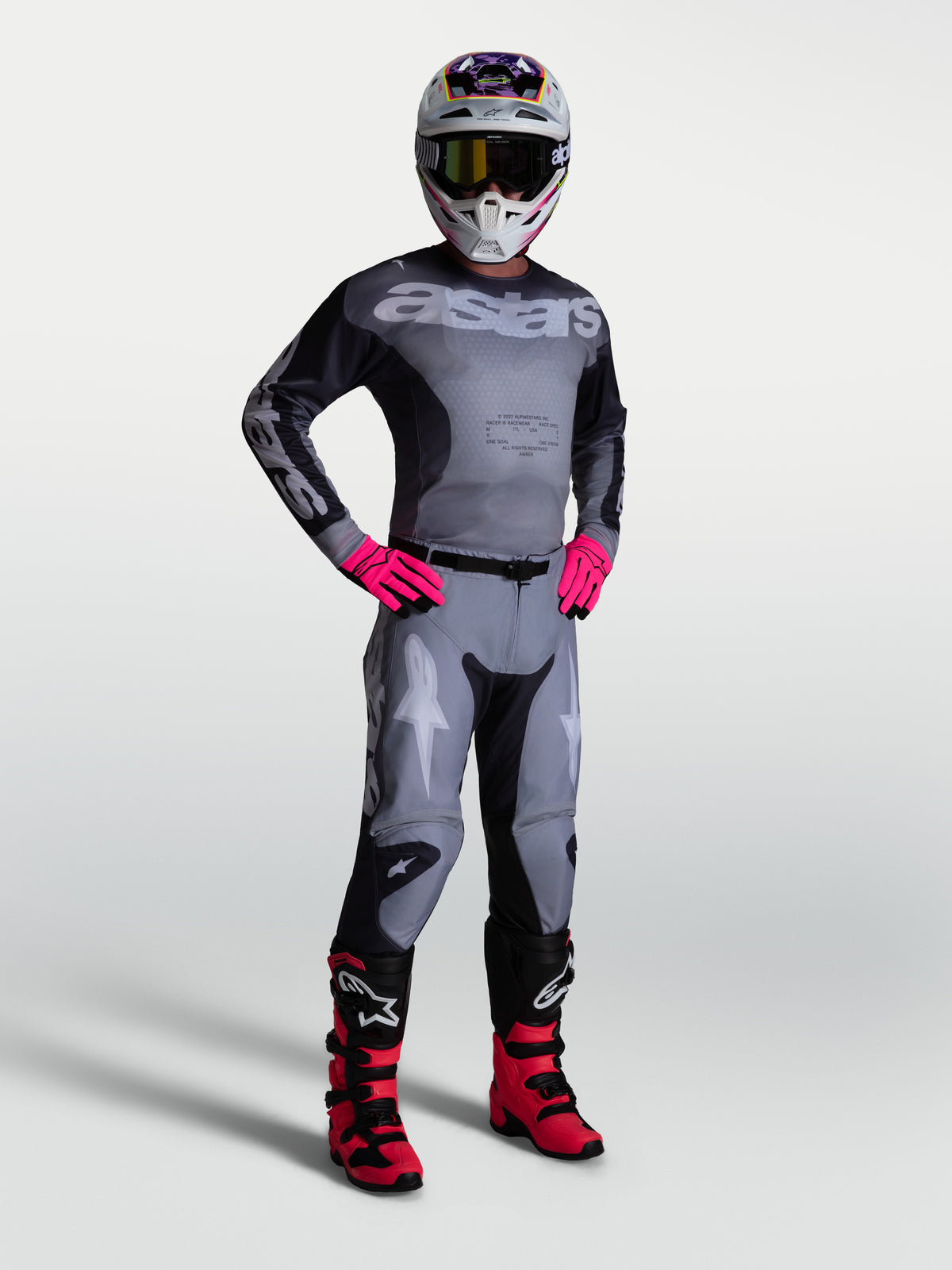 Alpinestars Racer Amber Pants and gear set in Graystone and pink, featuring durable motocross racing apparel for men.
