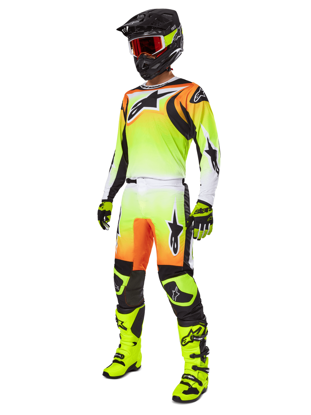 Motocrossrytter iført Alpinestars 2025 Fluid Wurx bukser i gul og sort, med en levende gul-til-hvid gradient og orange og sorte detaljer, vist som en del af et komplet racersæt med matchende trøje, sort hjelm og neongule støvler.