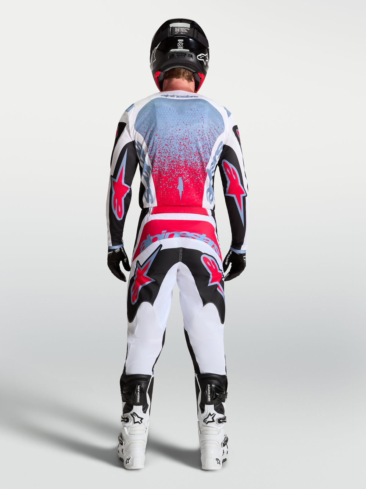 Alpinestars Fluid Drag bukser, motocrossbukser til mænd, sort og hvid med rød fluo, ergonomisk 3D-konstruktion.