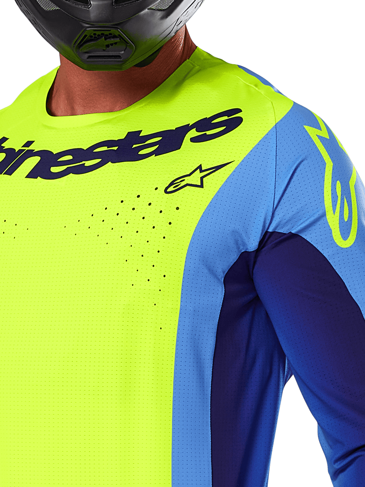 Alpinestars 2025 Techstar Melt trøje, motocross-trøje, gul fluo og blå, nærbillede der viser laserskårne ventilationshuller og mørkeblå branding, båret af en kører med sort hjelm, performance-udstyr til off-road racing