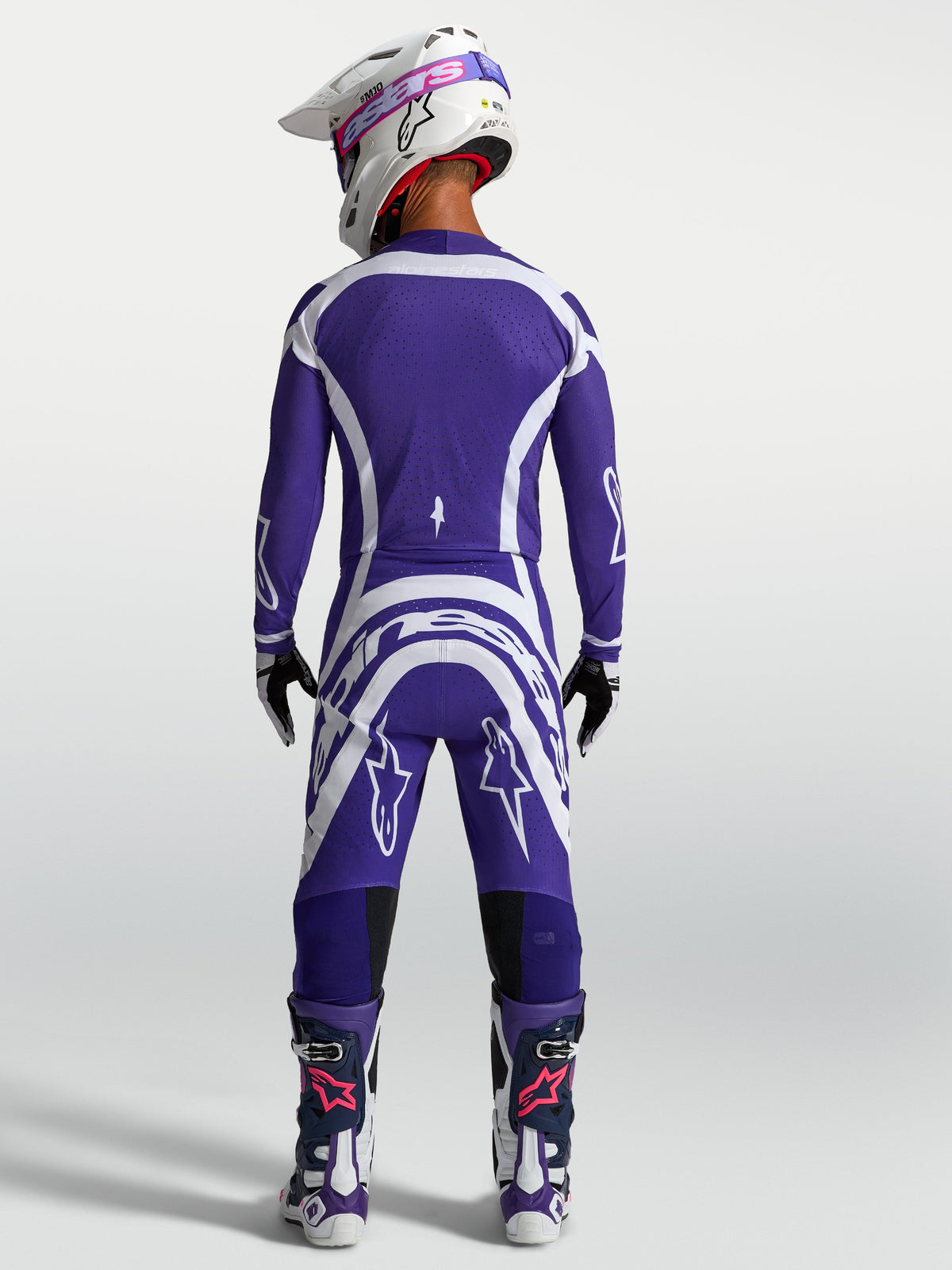 Alpinestars Supertech Vesta trøje og gear-sæt, herremotocrossudstyr i blå og hvid, atletisk race-pasform set bagfra.
