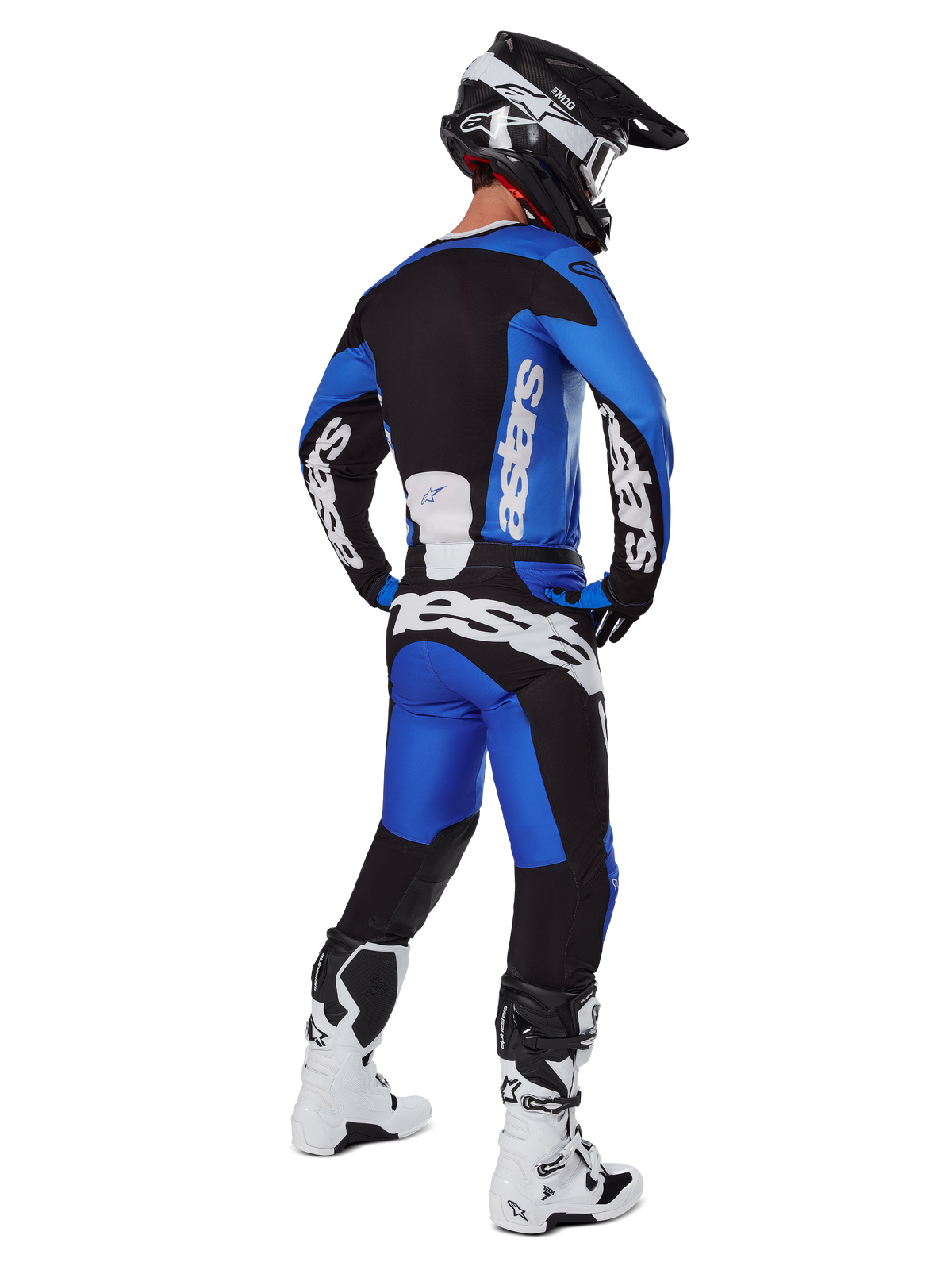 Alpinestars 2025 Racer Veil Gear Set, motocrosskører set bagfra iført komplet racerudstyr, blå og sort trøje og bukser med hvid Alpinestars-branding, sort hjelm og hvid-sorte støvler, koordineret sæt til off-road kørsel
