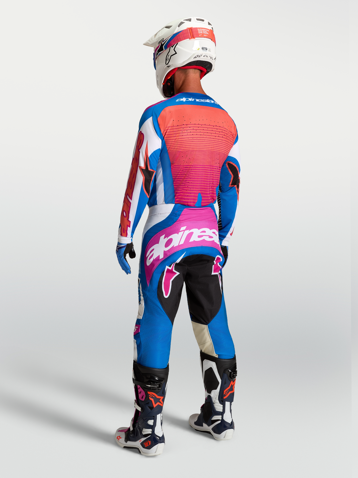 Alpinestars Techstar Maven Jersey and Techstar Maven Gear Set, blue and hot coral motocross gear, rear view.