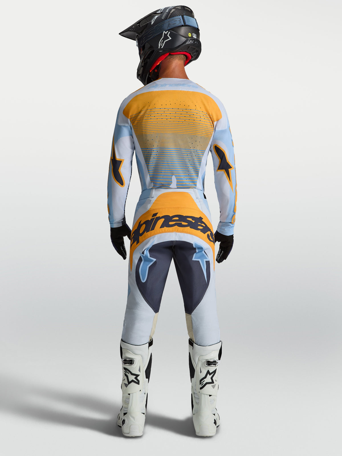 Alpinestars Techstar Maven trøje og udstyrssæt, motocrossracing til herrer, blå og orange, set bagfra.