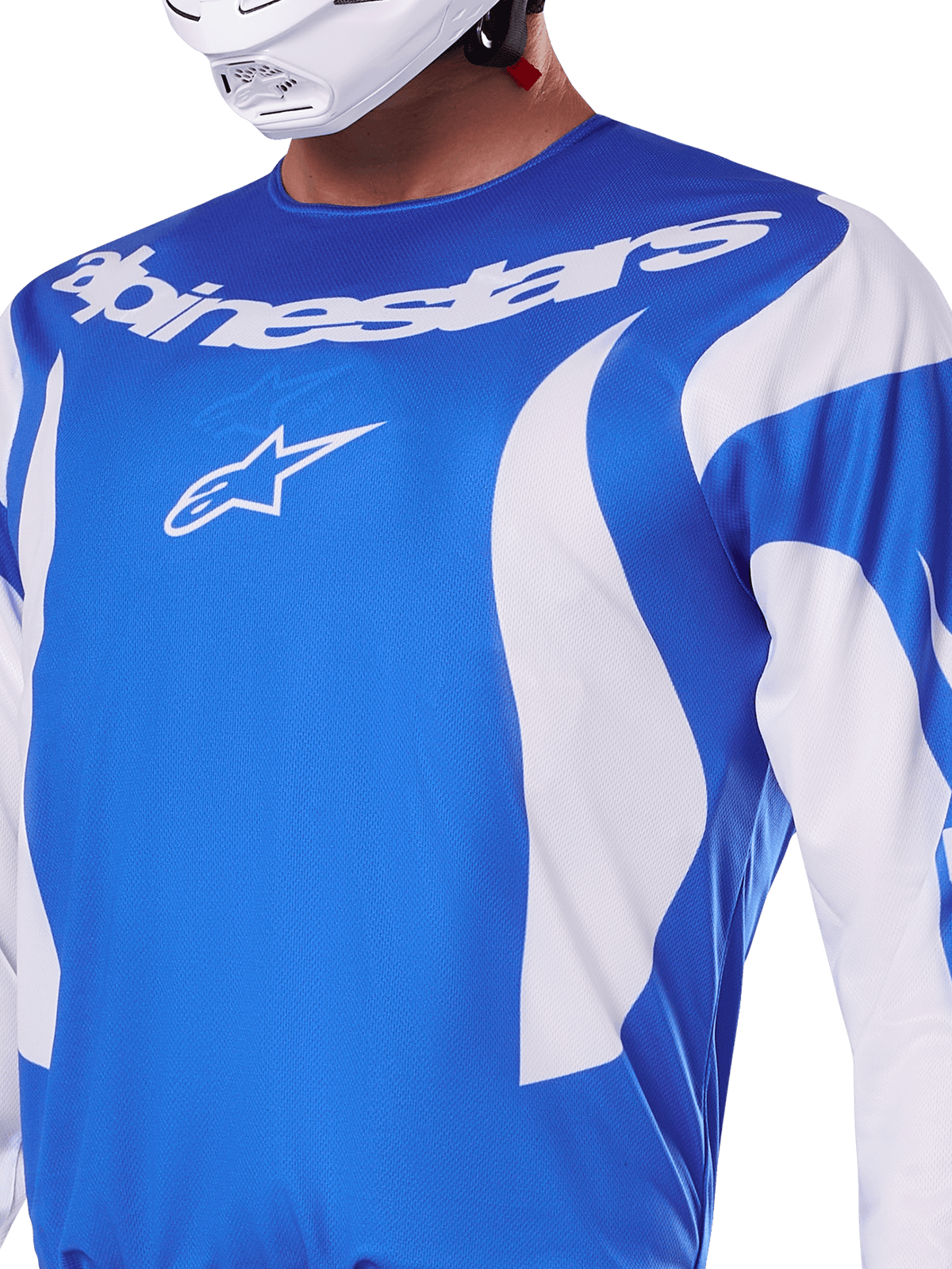 Alpinestars 2025 Fluid Haul jersey, blå og hvid, båret af en rytter med hvid hjelm, med hvidt Alpinestars-navnetræk og A-star-logo, atletisk pasform, letvægts fugttransporterende materiale til motocross og off-road kørsel