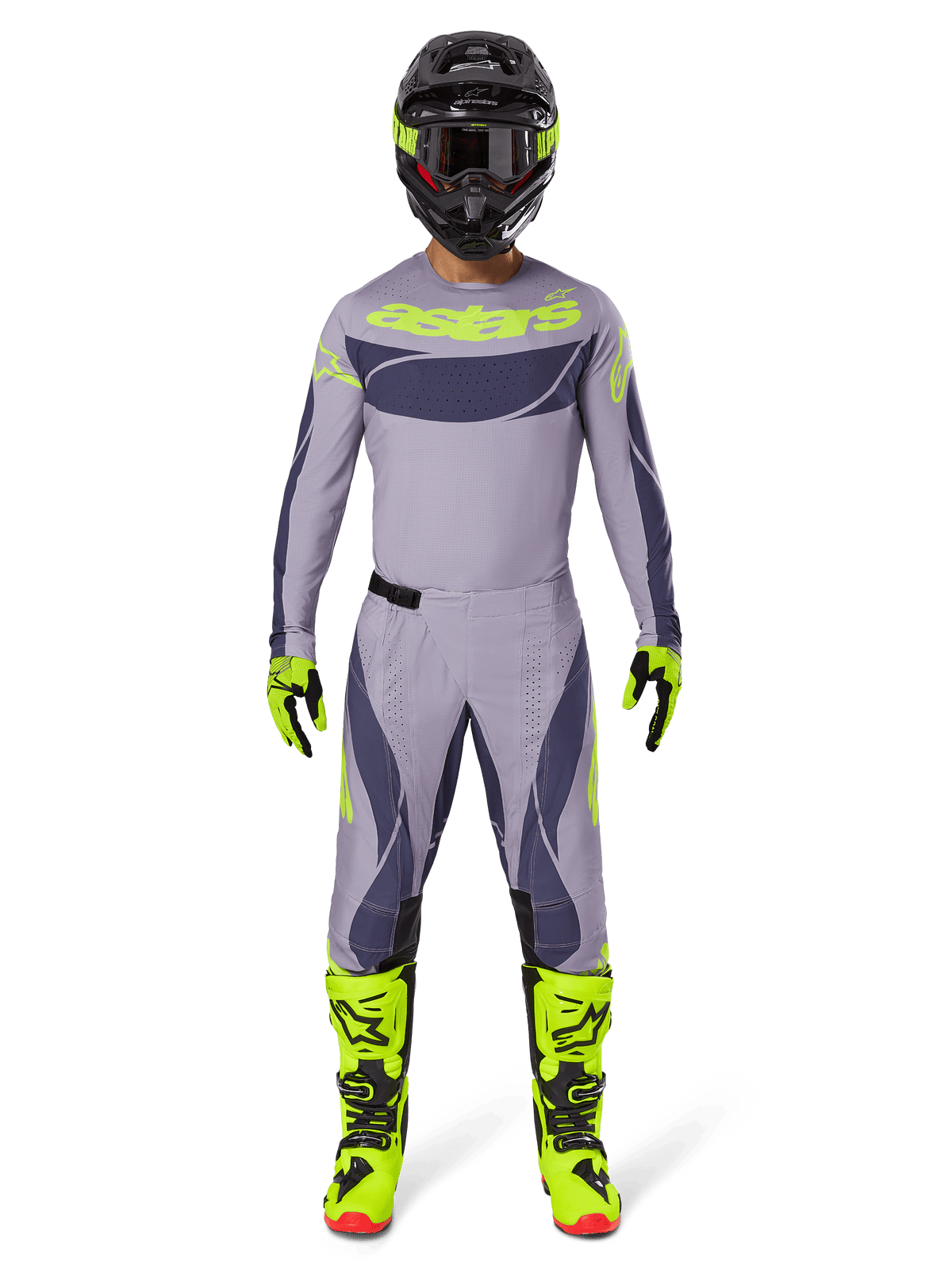 Motocross-rytter iført Alpinestars 2025 Techstar Dreem-udstyrssæt i grå og mørkegrå med markante neongule detaljer, komplet med matchende trøje, bukser, neongule støvler og en sort hjelm, designet til professionel off-road kørsel.