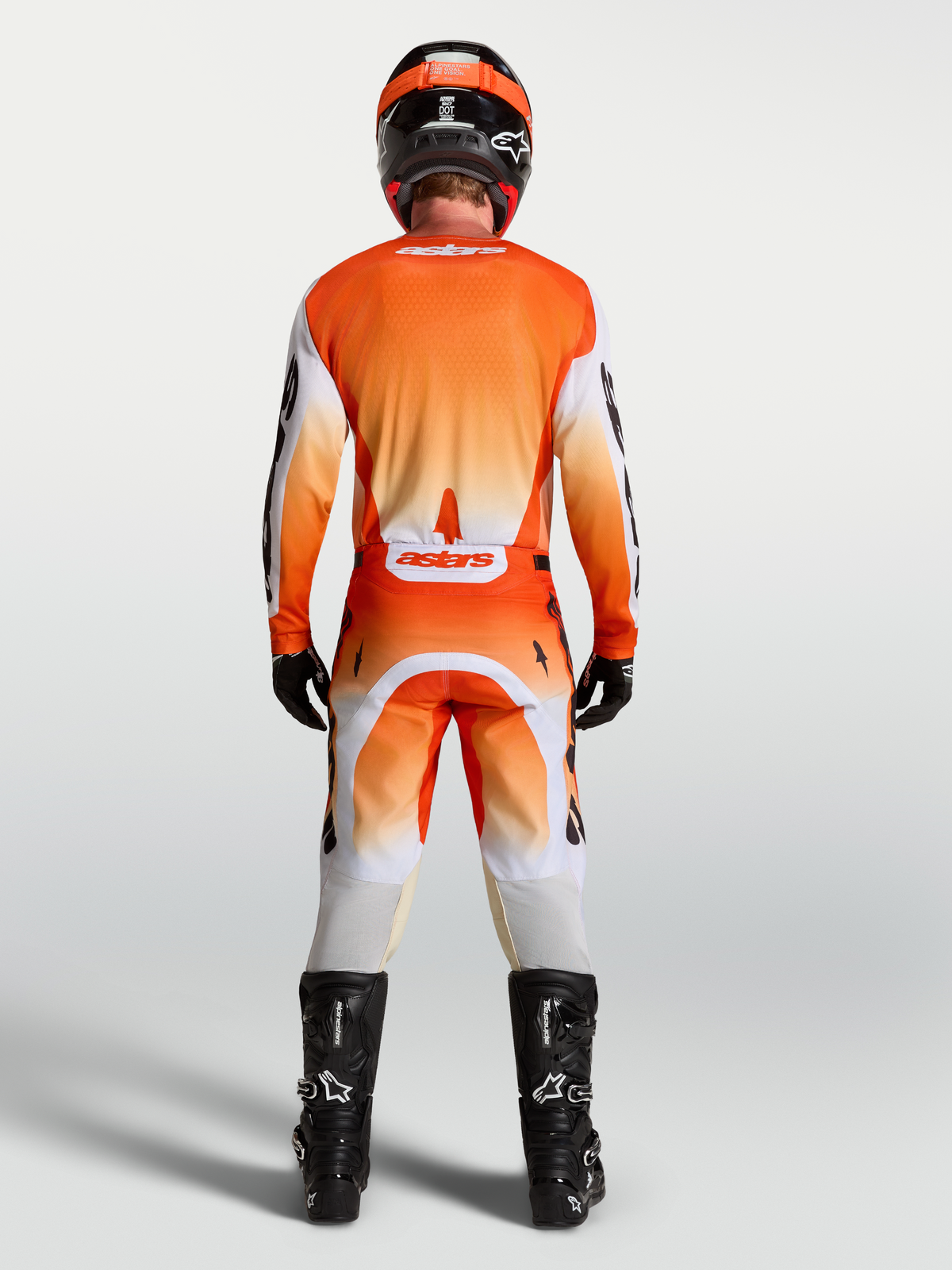 Alpinestars Racer Amber bukser og gear-sæt, orange og hvidt motocrossudstyr til herrer, set bagfra.
