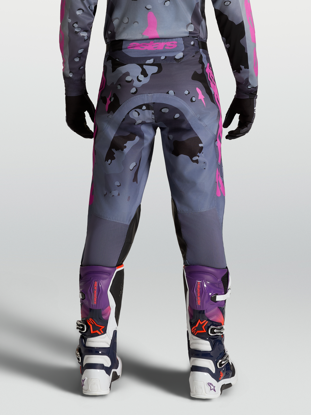 Alpinestars Racer Lone Pants, Motocross Racing gear for men, Gray and Purple Camo, rear view on model with matching MX boots.