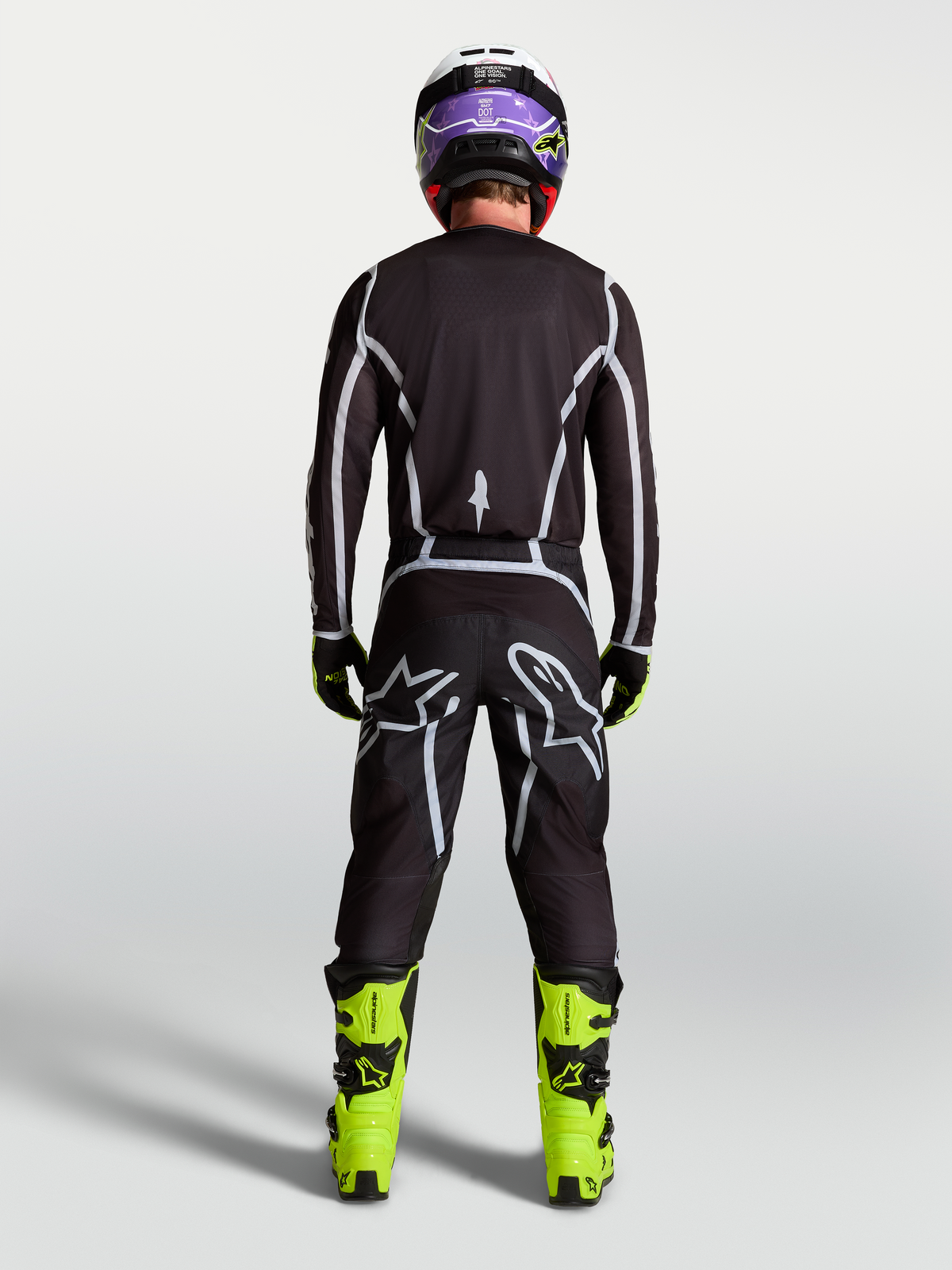 Alpinestars Fluid Apex V2 Jersey, Men's Motocross Gear, Black and Silver, rear view on rider in full racing kit.