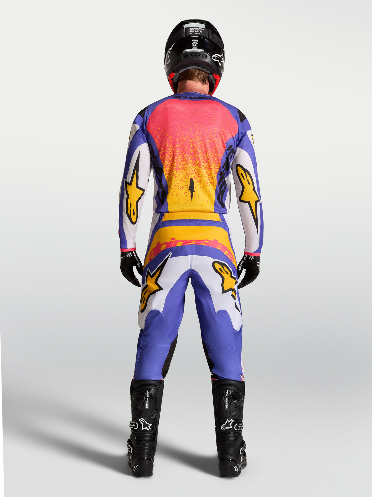 Alpinestars Fluid Drag Pants and Gear Set, Men's lilac and blue iris gold motocross outfit, rear view on model.