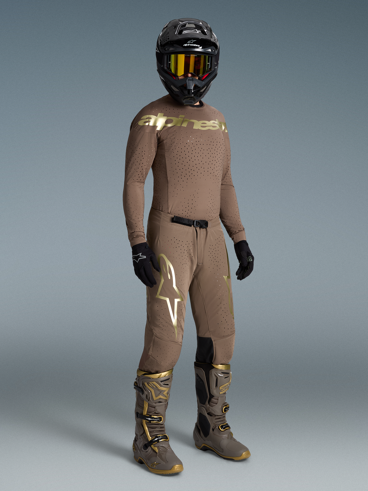 Alpinestars Limited Edition Supertech Air Gold Jersey, brown and gold motocross racing gear with laser-cut ventilation.