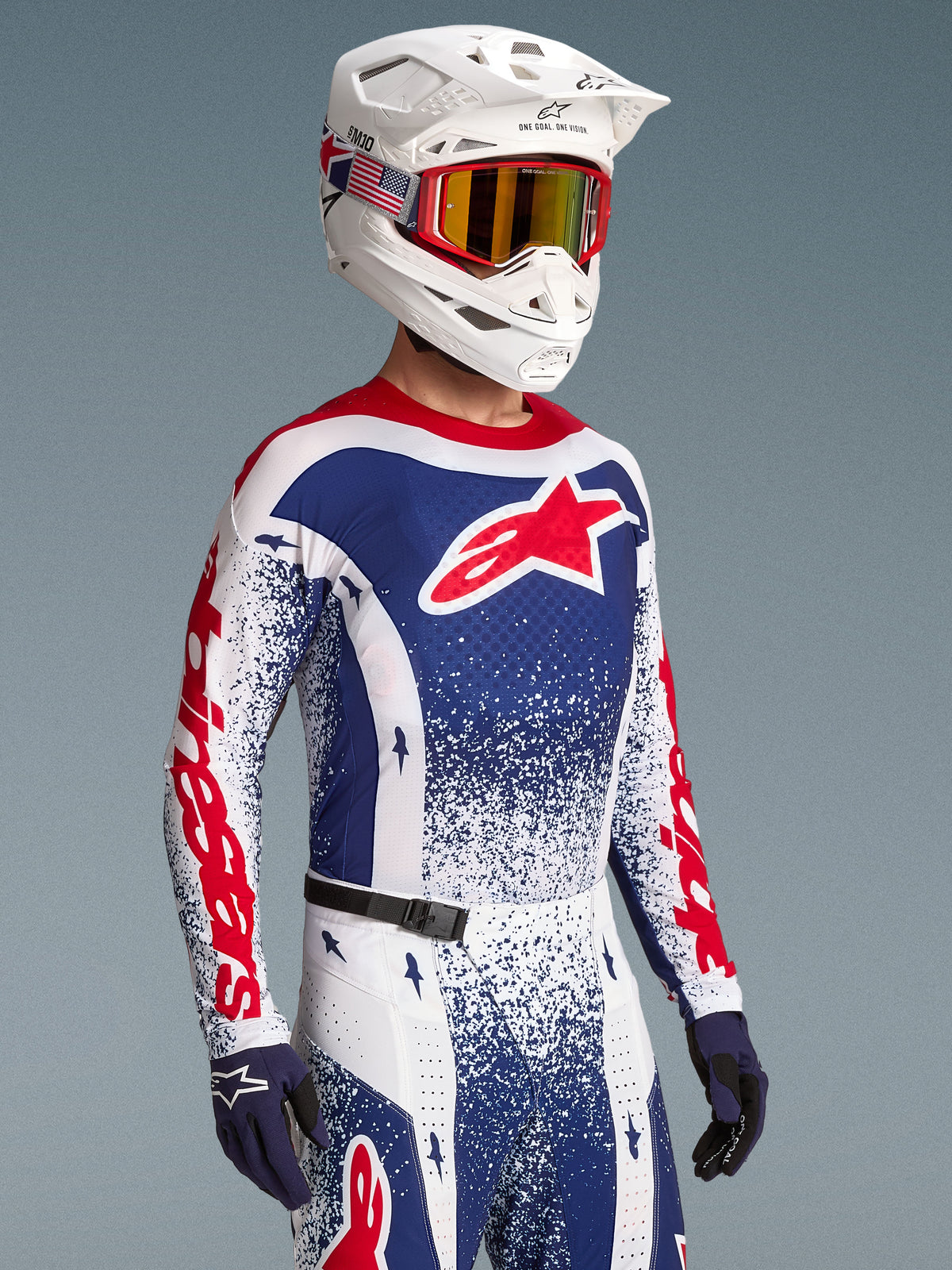 Alpinestars Limited Edition Techstar Unity Jersey, red and blue splatter design, on-model for men's motocross racing.