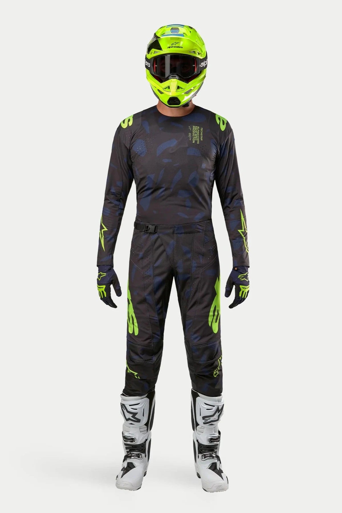 Alpinestars 2024 Techstar Rantera Jersey and Pants, Motocross racing gear set, Black Navy and Yellow Fluo, worn with a matching fluorescent yellow helmet and white boots, featuring bold yellow branding and technical mesh panels for off-road performance