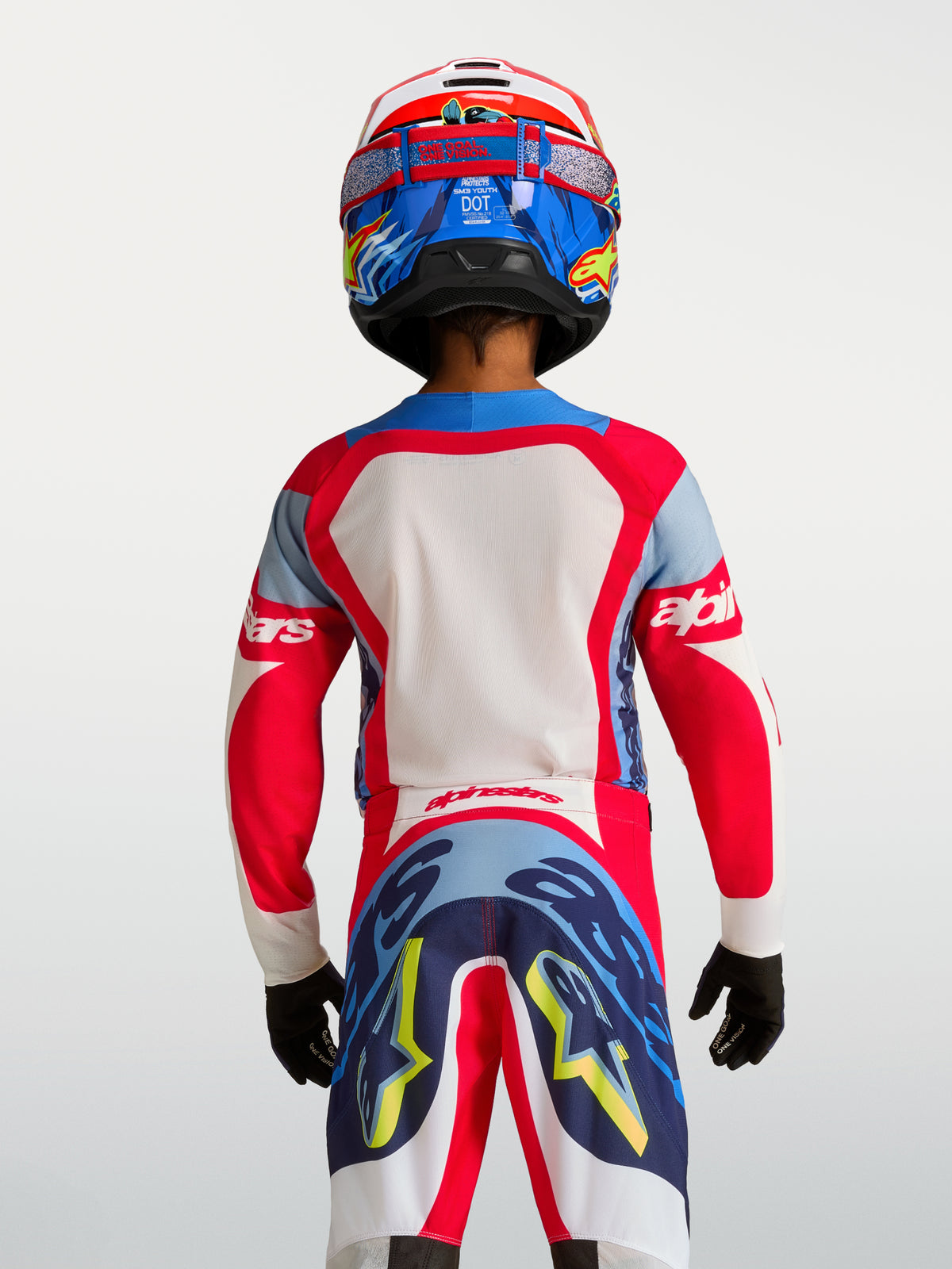 Alpinestars 2027 Trøje Supertech Dyna Ungdom, rød og navyblå motocross-trøje i letvægts mesh, set bagfra på en rytter